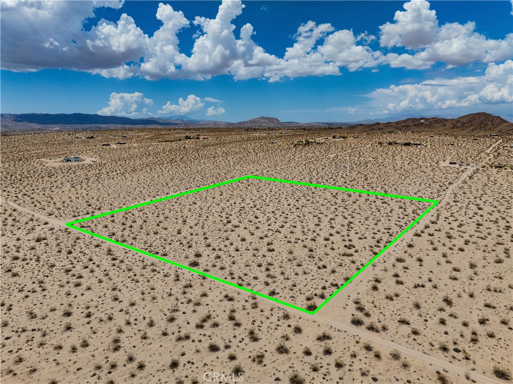 10-ACRE PARCEL in nice elevated location. Less than a mile to paved access – Sunfair Road. Short drive to Joshua Tree Music Festival. Surrounded by other large parcels to help retain the rural character of the location. Panoramic views. No water meter - needs to drill well or extend water main. No adjacent SCE electrical poles - needs solar. NOTE: Green lines demarcating boundaries in pictures are approximate, property has not been surveyed; street address is not official – do not use address or google maps GPS to locate property. To find property, please locate with APN: 0632-081-06
