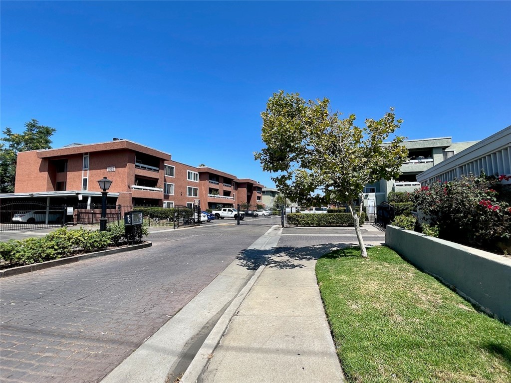 This top-floor, west-facing condo offers one of the best locations in the community—bathed in natural light, sunset views, and cool afternoon breezes. Inside, you'll find an open layout with updated vinyl plank flooring, a refreshed kitchen with classic shaker cabinets, granite counters, and stainless appliances. The living room features a cozy fireplace and flows onto a private patio with a storage closet and in-unit washer/dryer—no need to use the community laundry (though it's nearby if needed). Both bedrooms have west-facing windows, and the primary includes a walk-in closet. The bathroom has been updated with a modern vanity and lighting, plus there's a hallway linen closet for extra storage.
Two dedicated parking spots—one covered with bonus storage—are just steps from the building. The gated community features a lush central courtyard with jacaranda trees and a sparkling pool.
Escondido offers a vibrant lifestyle you won’t find anywhere else in North County. Enjoy downtown’s weekly farmers markets, Cruising Grand on Friday nights, and seasonal events at Grape Day Park. Catch a show at the California Center for the Arts, or hit the trails at Daley Ranch. You’ll also find three nearby lakes—Dixon, Wohlford, and Hodges—perfect for fishing or weekend picnics. Local charm runs deep here, with an eclectic mix of mom-and-pop shops, family-owned restaurants, and conveniences like Costco, Trader Joe’s, Target, and more all close by.