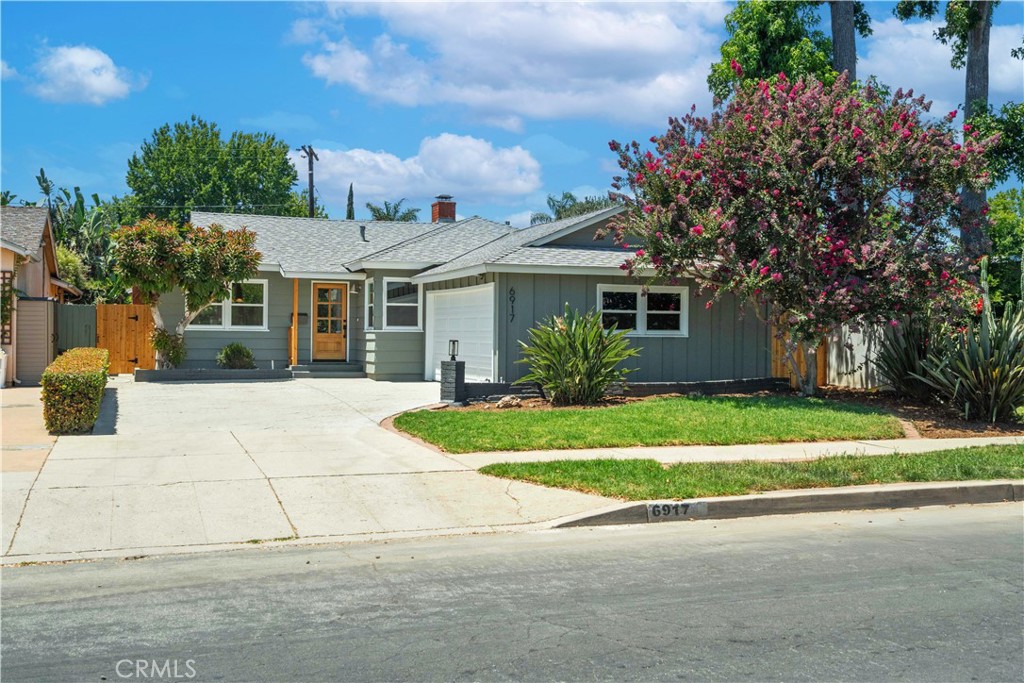 Welcome to this gorgeous Van Nuys showplace located in a lovely tree-lined neighborhood. Upon the entry, you're welcomed with an open floorplan showcasing beautiful wood laminate plank floors that flow seamlessly throughout. The inviting living room is highlighted with smoothly finished ceilings, recessed lighting & decorative fireplace that opens to the stunning chef's kitchen equipped with beautiful custom (soft closing) cabinets, gorgeous quartz countertops, designer tile backsplash, new stainless-steel appliances & large breakfast bar. The sunfilled family room is not to be missed with the cozy fireplace and walls of glass overlooking the private gounds and sparkling pool and spa. The elegant primary suite offers sanctuary with a spa-like ensuite bathroom featuring a designer dual vanity & a large custom walk-in shower. The spacious secondary bedrooms are adjacent to the tastefully upgraded hallway bathroom, which includes stylish tile, large tub and custom shower with designer vanity. Step outside and enjoy your private oasis featuring a large covered patio, mature landscaping and sparkling POOL/SPA with plenty of room to entertain your family & friends. Additional highlights include; new interior & exterior paint, Upgraded Dual Paned Windows, modern fixtures & hardware & finished 2 car attched garage. This GEM is the one you been waiting for!