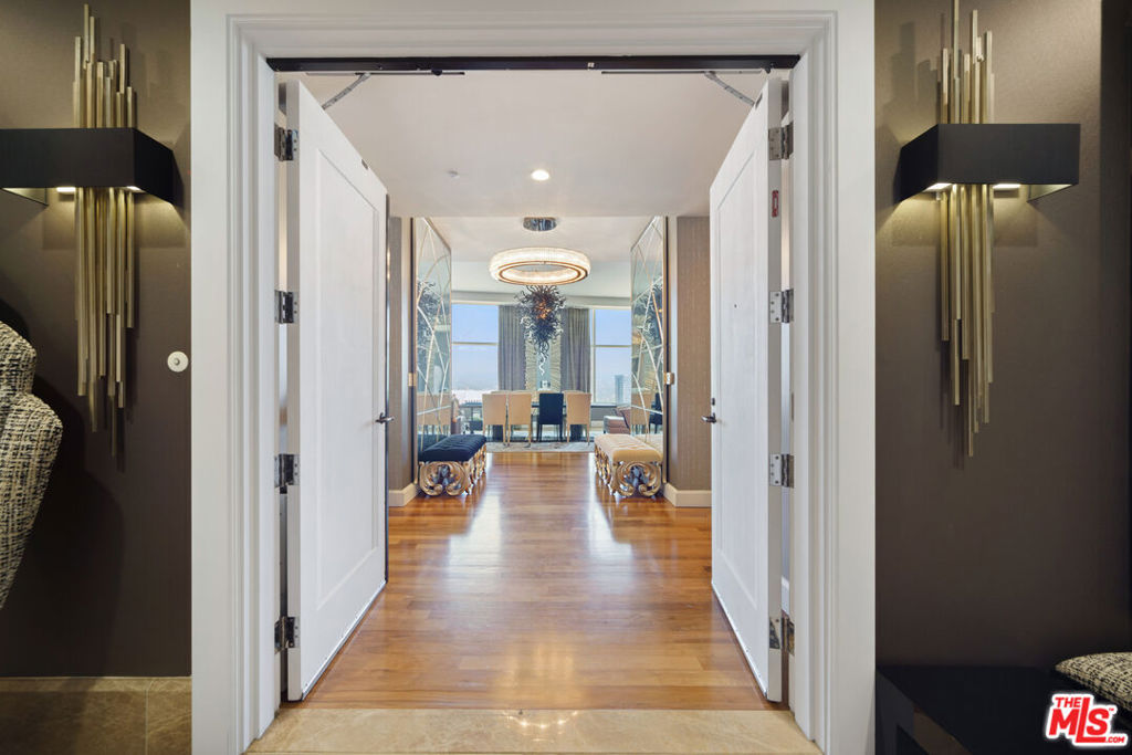 Experience a rare opportunity to live in one of Los Angeles' most iconic addresses. This extraordinary half-floor penthouse at The Century offers over 5,600 square feet of refined living, with three bedrooms, five bathrooms, and nearly 360-degree views stretching from the Pacific Ocean to the mountains and city skyline.Designed by Robert A.M. Stern, the residence blends timeless architecture with modern elegance. Floor-to-ceiling windows flood the grand living and dining rooms with natural light, while expansive terraces invite you to take in sweeping sunsets and sparkling city lights. The primary suite is a true retreat, complete with a private sitting area, spa-like bath, and meticulous custom finishes. Two additional guest suites and a gourmet kitchen make this home ideal for both quiet living and effortless entertaining.Life at The Century is defined by world-class amenities set amid four acres of private gardens. Enjoy a resort-style pool, state-of-the-art fitness center, yoga and Pilates studios, a luxurious spa, screening room, wine cellar, and exclusive dining and entertaining spaces. With 24-hour guard-gated security, valet, and front desk services. The Century offers unmatched privacy and ease in the heart of the city. An elevated lifestyle reserved for the few. Call to schedule a private tour and experience estate-style living in the sky.