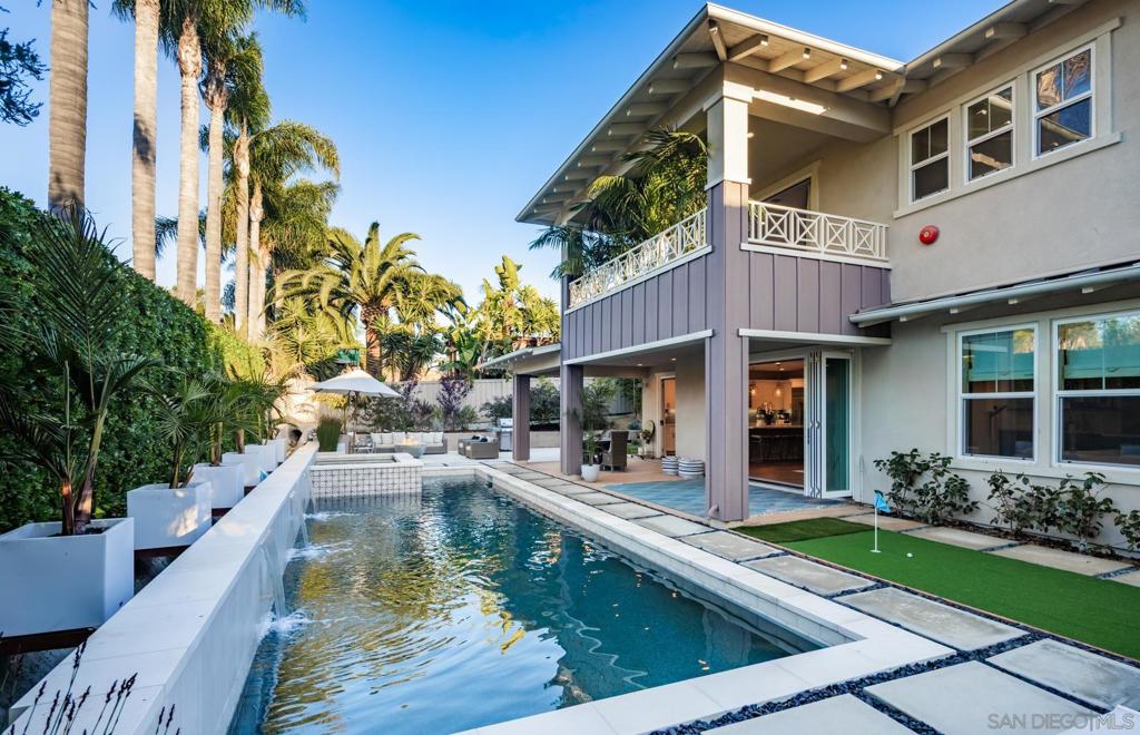 Discover modern luxury in this exquisite 2020 Shea Homes residence, nestled in the prestigious Alia community at the end of a private cul-de-sac. This 5-bedroom, 4.5-bathroom masterpiece seamlessly blends contemporary design with coastal charm, featuring expansive bi-folding doors that open to a private oasis complete with a low maintenance landscape, pool, spa, water features and custom putting green. The gourmet kitchen shines with the GE Monogram Statement Collection and a striking Calacatta Gold Silestone Quartz island, while the primary suite offers a private balcony and a spa-inspired ensuite with custom Jeffrey Court tile.  Designed for both intimate living and grand entertaining, the home includes a main-level bedroom suite, a great room with built-in surround sound, custom cabinetry, and energy-efficient owned solar panels. Just a mile from Leucadia beaches and coastal dining, and close to Fox Point Farms and Encinitas Ranch Golf Course, it offers easy freeway access and proximity to top-rated San Dieguito schools. This is your opportunity to own a turnkey luxury retreat in one of North County's most sought-after communities.  ***