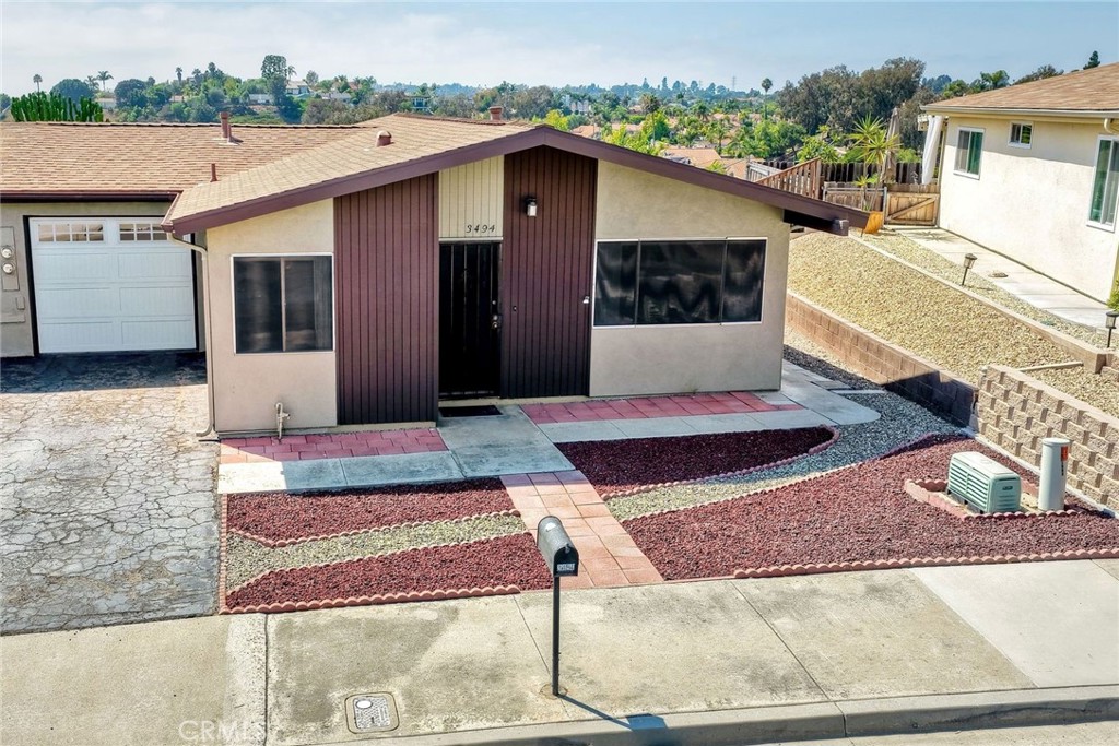 A rare opportunity in Costa Serena—this 1,187 sq. ft. Oceanside home offers incredible potential to create your very own coastal sanctuary. While largely in its original form, the home is clean, well cared for, and ready for updating, giving you the perfect canvas to add your personal touches.
Inside, you’ll find a light-filled west-facing oversized permitted bonus room, two bedrooms, and one bathroom. The garage includes a convenient workstation, and the backyard features multiple sitting areas where you can enjoy ocean views, cool coastal breezes, and a beautiful yard with room to garden or relax. The raised garden bed is already in place and the beautiful plumeria outline the west facing yard.
With great bones, no HOA, a 55+ community, flexible spaces, and an unbeatable location in one of Oceanside’s most desirable coastal communities, the possibilities here are endless. Bring your vision and imagination to transform this property into the coastal retreat you’ve been dreaming of.