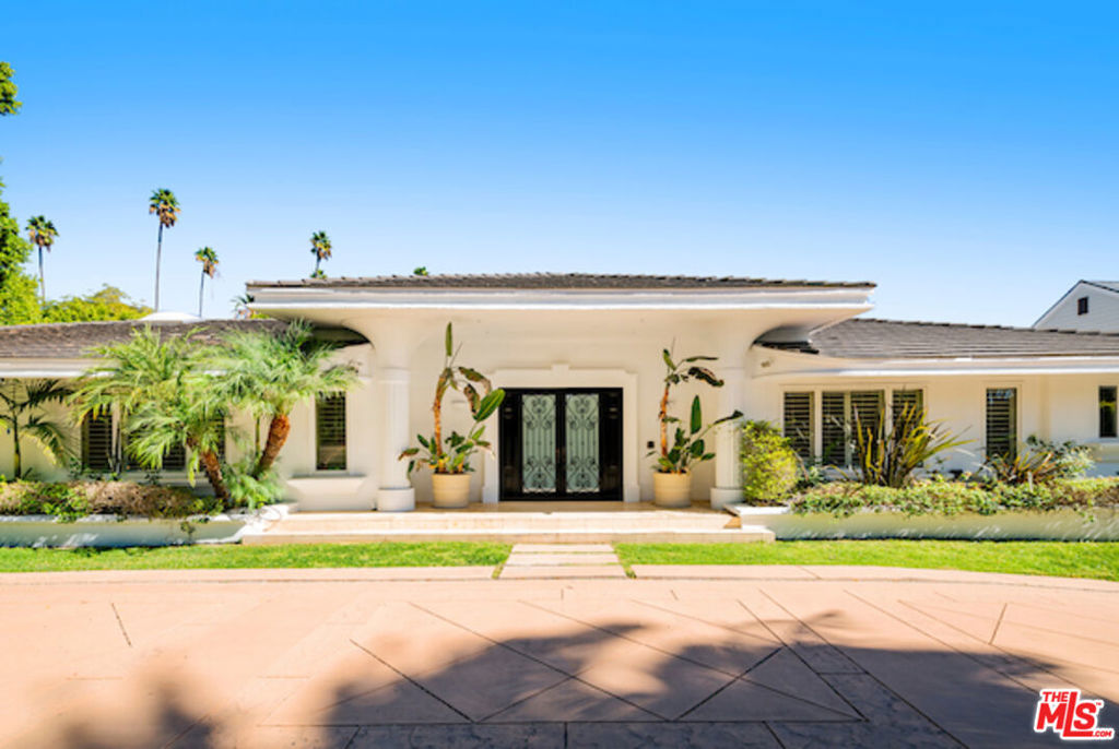 Rare Single Story Mediterranean family estate in Beverly Hills Flats. Located in one of the most sought-after neighborhoods in Los Angeles. This estate is just two blocks from the world famous Beverly Hills Hotel and close to great shopping and restaurants on Rodeo Drive. Elegant double doors open into a large open living area with step down formal living area with stone fireplace. Adjacent to the cook's kitchen with stainless steel appliances, large pantry & laundry area, this home offers a cozy elegant secondary living area equipped with a built-in bar great for entertaining. This perfect family home offers large bedrooms with nice built-in cabinetry. The primary suite and main living areas open to a beautifully landscaped yard with pool, spa and walls of mature hedges that provide the utmost privacy. This 6 bedroom and 5.5 bathroom home is over 5,300 SF and is on a 15,000+ sq ft lot. Don't miss this magnificent Mediterranean in Beverly Hills!