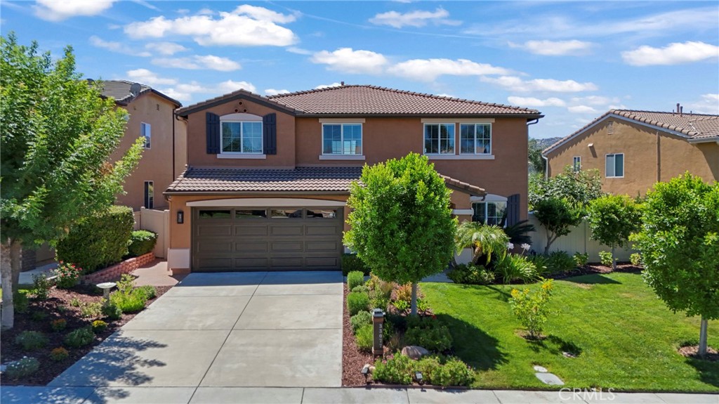 Welcome to this beautifully upgraded Redhawk home in highly desirable South Temecula at the end of a cul-de-sac. With a freshly painted exterior, smart features throughout, and NEM 2.0 solar with dual battery backup, this home blends modern convenience with timeless style. Step inside to a bright seating area and dining room that flow into an open-concept family space filled with natural light. The stunning white-on-white kitchen is sure to impress the cook in the family. Designed with recessed lighting, brand-new stainless steel smart WiFi appliances (including dual ovens with convection, dehydrate, and air-fry modes), a pot filler, large pantry, custom pull-out drawers for ease of use, and a center island with bar seating and pop-up charging station. The kitchen flows seamlessly into the family room where you’ll enjoy a gorgeous stone fireplace, ceiling fan, and large windows overlooking the backyard. A stylishly remodeled powder room full of character & a laundry room with storage complete the main level. Upstairs offers an updated full bathroom and five bedrooms with ceiling fans, including the primary suite. The primary suite features mountain views, a walk-in closet, dual sinks with defrost mirrors & a separate tub & shower. Additional upstairs spaces include a built in desk area and a flexible loft with an additional built in desk and adjacent bedroom—also perfect for a media room, home gym, office, teen room, or in-law suite. Designed with versatility in mind, this layout adapts to your lifestyle! Step outside to a lush backyard retreat, complete with an alumawood patio cover with dual ceiling fans, a second gazebo seating area, tranquil koi pond, fruit trees (lemon, cherry, pear, peach, and orange), and two large side yards. Plenty of space here to relax & enjoy the beautiful weather year round. Extra features include with epoxy garage flooring with storage and 250V plug for EV charger, tankless water heater & smart home upgrades (Ring doorbell & alarm, smart thermostat, door lock, irrigation control, and more.) Located in South Temecula near top-rated schools (including Great Oak High), parks, wine country, and with easy access to the 15 Freeway for commuters. This home truly has it all— modern upgrades (see supplements for complete list of nearly $200,000 in upgrades), smart technology, solar savings, and an unbeatable location!
