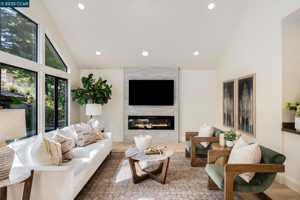 WOW! This is the best value in Blackhawk! Over $200K in recent updates! Modern Luxury Meets Laid-Back Vibes. Tucked behind the exclusive gates of Blackhawk CC, this stunning home checks every box for the modern lifestyle. You're greeted by soaring ceilings, natural light, & white oak-wide plank floors setting the tone for elevated, comfortable living. The open-concept connects a spacious kitchen with a bright, airy family room featuring a statement fireplace & fully updated bar—cocktail hour just got an upgrade! Outside, the wrap-around patio decking for extra space to host sunset dinners to weekend pool parties. The primary suite is a true escape—privately tucked away on the main floor with dual-sided fireplace, spa soaking tub, luxe wood cabinetry, oversized walk-in closets. Oh, and there’s private access to the pool + spa for those spontaneous evening dips! Need to work from home? The converted 3rd garage bay has been transformed into a private office. Upstairs, you’ll find a roomy guest suite, two oversized bedrooms with a shared bath, and a large bonus space (game room, media room, guest bed—you name it). Don't miss the SOLAR! This is a house you will love to come home to!