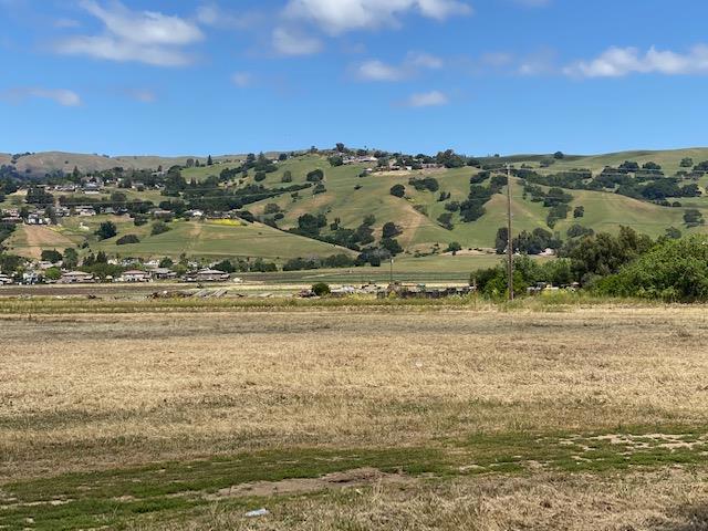Welcome to your unique opportunity to own 4.44 acres of flat, usable land with breathtaking views of the East Mountains of Morgan Hill! This property offers endless possibilities, including the potential to create a vineyard or grow crops. With a 2 bedroom, 1.5 bath home that needs TLC and repairs, this property is perfect for those with a vision. Located in a desirable area of Morgan Hill, it combines the peaceful country lifestyle with modern conveniences just a short distance away. Water, septic, and electricity are already installed, making it easy to start planning your dream home or farm. The property's proximity to major freeways, shopping centers, and recreational areas adds to its appeal. Don't miss this once-in-a-lifetime opportunity to own your own slice of paradise in Morgan Hill. Come and explore the possibilities for yourself and bring your vision to life!