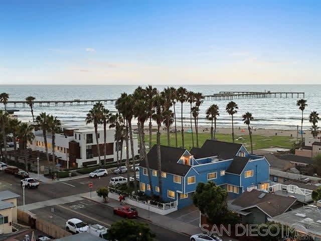 Huge Beach Views!! Starfish Cottage | Ocean Beach Summary Upscaled, remodeled 3BR/2BA top-floor townhouse with unobstructed beach, pier & sunset views. Relax on the rooftop deck with 360° vistas of La Jolla & Point Loma, or step outside and you’re on the sand! Walk to Ocean Beach’s restaurants, bars & shops. Perfect for a surf, sun & sunset getaway. The space Bright and airy with vaulted ceilings, coastal décor, and endless views from the living room, dining area, kitchen, balcony & master suite. The open kitchen includes a breakfast bar. Living room features a gas fireplace, sofa bed & flat-screen TV. Step onto the balcony with BBQ or head to the rooftop deck for sweeping ocean & city views. Sleeping (max 8) • Bedroom 1 – King suite w/private bath • Bedroom 2 – Queen (main level) • Bedroom 3 – Queen (upstairs) • Living room – Sofa bed 2 baths total. STR-11235L | TOT-617561 Guest access Entire home, balcony with BBQ, rooftop deck. Includes 2-car tandem parking + street parking. The neighborhood Unbeatable location—steps to the beach, surf zone & tide pools under the pier. Enjoy bonfires, boogie boarding, swimming, and sunsets right outside your door. Walk two minutes to Newport Ave for dining, shopping & nightlife. The unit is stocked with boogie boards, towels, chairs, toys & umbrella. Surfboard and bike rentals nearby, Bird scooters often at the curb. Huge Beach Views!! Starfish Cottage Ocean Beach Summary This is an awesome newly upscaled remodeled unit with amazing unobstructed views of the beach, pier and sunsets. Watch the waves crash on the beach and enjoy the ocean breezes from this top floor 3 bedroom, 2 bath townhouse with a view roof top deck! Step out of the door and you are on the beach, you can't beat this location. Walking distance to all the restaurants and bars in Ocean Beach. This is the perfect spot to relax and go to the beach. The space This is a newly remodeled unit, top floor with STUNNING VIEWS! You can see the beach, waves crashing, and the pier when you enter the front door. Huge views from the living room, dining room, kitchen, balcony and master bedroom. Roof Top Deck also has 360 degree views! Tastefully decorated in a beach theme, the living room and dining room have vaulted ceilings and lots of windows for natural light. The kitchen is open to the dining area and has views of the beach. The breakfast bar is open to the kitchen and dining area. A nice sized balcony with stunning views has a private BBQ. The large rooftop deck has VIEWS of the beach, La Jolla and Point Loma. There is a king suite with its own bathroom, a queen bedroom on the main level, and a queen room upstairs. There is also a pullout sofa in the living room. The living room has a gas fireplace and a flat-screen TV mounted on the wall. The rooftop deck has 360 degree views of the beach, the local hills, and the Sea World tower. Step outside and you are at the beach, less than a minute walk!! Have a bonfire on the beach just steps away from the building. Perfect location for boogie boarding, swimming, and next to the surf zone. Amazing tidepools right at the beach under the pier. Once you park the car there is no need to drive anywhere, within walking distance to restaurants, bars, and shopping. This unit comes with a 2 car tandem parking space. This location is perfect for walking to the main street "Newport Ave" it's a 2 min walk to restaurants, bars and shopping, the famous Ocean Beach Pier, and tide pools. You can watch the pelicans fly by, waves crash on the beach, and stunning sunsets all from the unit or the few steps to the beach. The unit has everything you need for your vacation including boogie boards, beach towels, and beach chairs, sand toys and a beach umbrella. Surf board and bike rentals nearby, Bird scooters are usually right out front for rent. STR-11235L TOT-617561 Guest access The entire unit is the guests, including the kitchen and private BBQ on the balcony. There is a 2 car tandem parking space a...