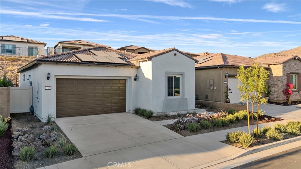 Welcome to 11920 Shadeland, situated above Temescal Valley in the Cedarwood neighborhood of Terramor, a vibrant 55+ Active Adult community. This brand new single-story rental home features 2 bedrooms and 2 bathrooms, and is ready for you to move in! This lovely home offers a spacious great room that seamlessly flows into a gourmet kitchen, complete with an oversized island topped with Calcutta quartz countertops and upgraded walnut shaker-style cabinetry. The kitchen is equipped with stainless steel appliances, including a designer hood, convection microwave, full-size oven, and a 6-burner cooktop. The floors are adorned with luxury vinyl planks in a warm walnut hue, with plush carpeting in the bedrooms for added comfort. The primary ensuite offers an oversized stand-up shower, dual vanity, walk-in closet, and a convenient linen closet. The second spacious bedroom is complemented by a hallway bathroom featuring a relaxing soaking tub. The virtually maintenance-free backyard is beautifully designed with system pavers and includes an enclosed patio, perfect for outdoor enjoyment. Other features include Recessed lighting, an indoor laundry room with hookups, an attached two-car garage, 10-foot ceilings throughout, a house fan, and solar power to keep your electric costs low. Included in your lease is access to the social and recreational Terrace Club, which offers two community clubhouses, a gym, an outdoor pool and spa, an indoor saltwater pool, bocce ball and pickleball courts, and miles of walking trails to keep you active and engaged. You'll also enjoy close proximity to world-famous Tom’s Farms, shopping