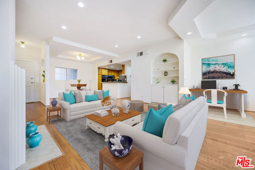 Chic. Elegant. A Rare Find. 2 BEDROOMS/2BATHS PLUS OFFICE/DEN/LIBRARY. Single Level. Prime location in Sherman Oaks. Luxury Condominium Building. KITCHEN AND 2ND BATHROOM HAVE BEEN UPDATED AND NOW ARE IN SPARKLING WHITE COLOR! This tastefully remodeled spacious condo features modern luxury and sophistication. Abundance of windows allow the natural light to create a warm and inviting space. Recessed lighting, granite counter tops, hardwood floors, wood shutters throughout. Master bedroom is in a separate wing with en-suite bathroom with walk-in closet and lots of light. SIDE-BY-SIDE LAUNDRY with ample storage and closet space. Amenities include contemporary community room and lobby, state-of-the-art gym, pool, - living at its finest!