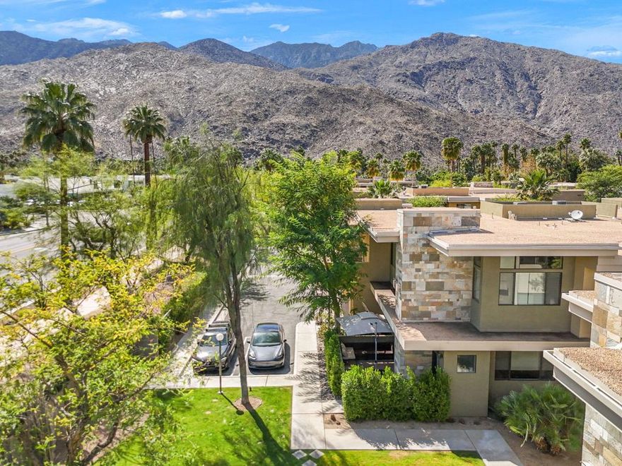 Welcome to Biltmore Colony, a gated community in South Palm Springs where modern architecture meets resort-style living. This upper-level two-bedroom, two-bath condo offers a bright, open layout with soaring ceilings, a stylish kitchen with stone countertops, and direct access to a private balcony perfect for relaxing or entertaining. Both bedrooms feature spacious walk-in closets, while the bathrooms showcase elegant glass-tile finishes. Additional highlights include a built-in desk nook, full-size laundry room, and a private two-car attached garage with finished flooring for a polished look. Residents enjoy access to three pools and spas, private cabanas, an outdoor kitchen and dining area, a fitness center, fire pit, and a beautifully designed clubhouse surrounded by manicured desert landscaping and mountain views. Situated on fee simple land, this home is ideally located just minutes from fine dining, boutique shopping, and top-rated entertainment, with many options within walking distance--offering the best of Palm Springs living in one of its most stylish and well-appointed communities.