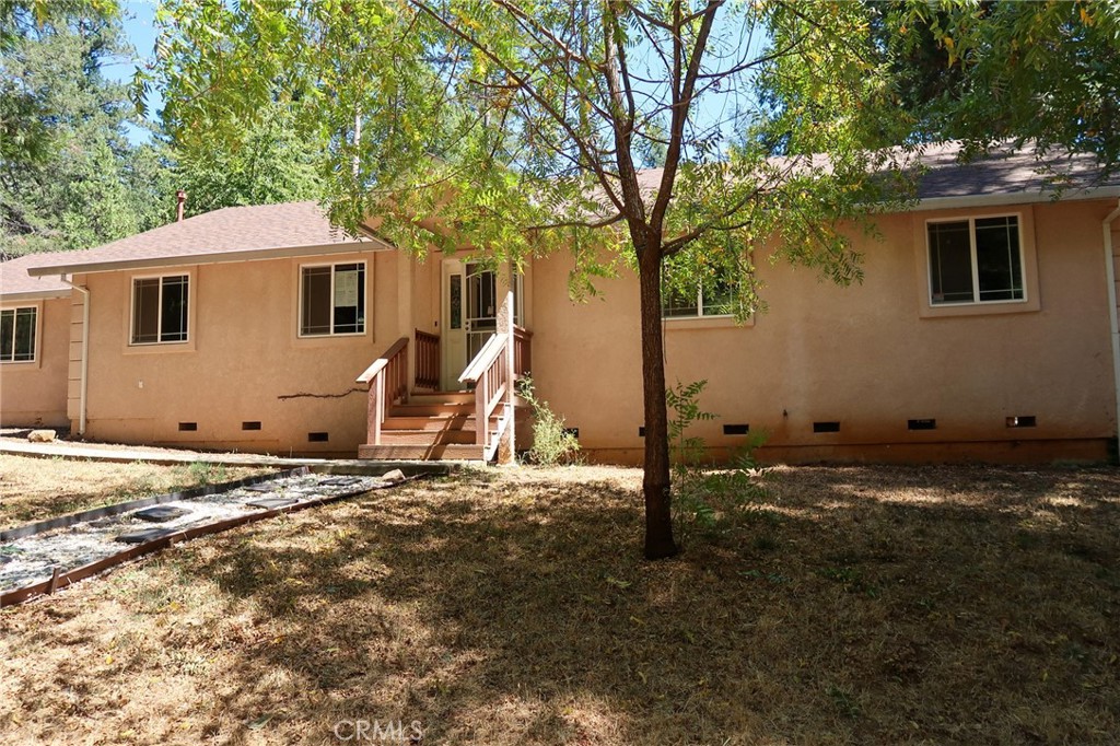 BEAUTIFUL 3 BEDROOM 2 BATH HUD HOME BUILT IN 2006 ON LARGE CORNER LOT! Vaulted ceilings, attractive gas fireplace. Bright kitchen with an eating bar, tile counters and floors and pantry. Stainless steel appliances, microwave and stove. Separate dining room family area that overlooks backyard & deck. Spacious master suite featuring two closets, dual sinks and private separate deck through sliding glass door. Additional bedrooms are spacious. Ceiling fans throughout the house. Convenient inside laundry, lots of storage. Peaceful backyard is fully fenced with fire pit, two decks and lighting on the rock walls. Large two car garage with workbench and shelving, accessed by other street. Lots of additional parking, room for RV or boat?. Located near to schools, Magalia is nearby to many outdoor recreational activities, including fishing, hunting and more. Lime Saddle Marina and Lake Oroville, Paradise Lake, High Lakes and Feather River. This home is waiting for you to make it your own!