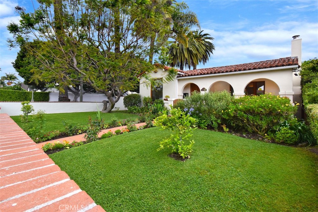 Spanish-Style Charm with Mid-Century Perfectly situated between Westwood and Century City, this beautifully updated Spanish-style residence offers timeless design blended with modern comforts. With three bedrooms and 2¾ baths, the home includes a private rear suite that opens to a tranquil backyard terrace—an ideal retreat for relaxation or entertaining. Thoughtful renovations elevate the property’s appeal, including newer HVAC, copper plumbing, refreshed kitchen with Viking 6 burner stove and double oven and updated baths, new wood flooring, updated exterior stucco, and meticulous landscaping that provides privacy and serenity amidst the urban setting. Step inside to a spacious living room that flows effortlessly into a separate dining area, perfect for both everyday living and gatherings. At the rear of the home, the expansive primary suite features double doors opening to the serene backyard, creating a peaceful escape. Bath with soaking jetted tub and separate walk-in shower. Two additional bedrooms offer flexibility—one an en-suite—ideal for guests, a home office, or a future ADU/studio conversion (buyer to check with the city) excellent investment potential.
The garage is conveniently positioned for easy entry and exit, adding to the home’s overall functionality. All this on a tree lined street close to just about everything that the westside has to offer!