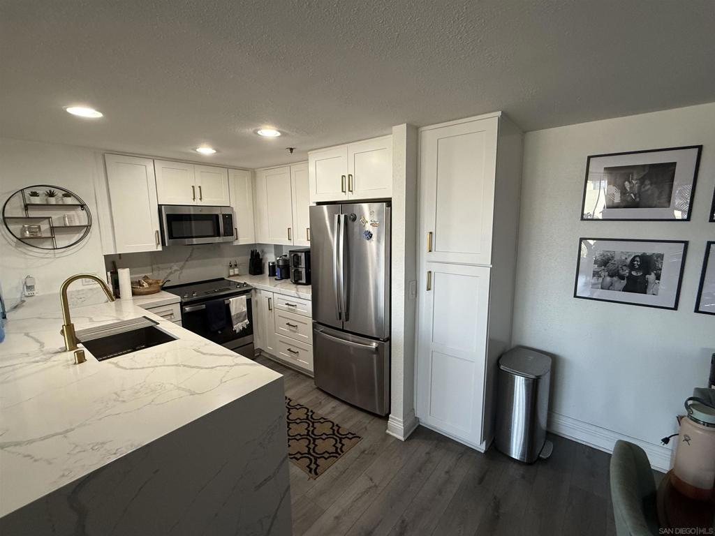 This beautiful unit is on the 4th floor end unit . Nice Balcony with retractable awning,with view of downtown areas. Beautiful white and Gray Granite Counter tops, Stainless Steel Appliances, Washer and Ventless Dryer, Security doors and intercom system, Gray Laminate flooring throughout. Updated Bathrooms and more. Complex has a pool and has underground Parking and storage. Walk to Downtown activities, or uber to 5 minutes of fun and night life.