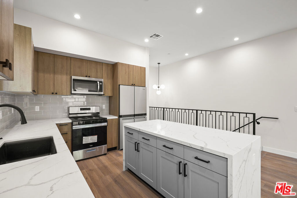 ** AMAZING LOCATION ** PRIVATE 2 CAR ATTACHED GARAGE ** CENTRAL A/C ** PRIVATE ROOFTOP DECK ** BALCONIES ** WASHER/DRYER ** PET FRIENDLY ** Experience luxury Spanish-style living at its finest in this newly constructed residence at 1733 S Barrington Ave. This beautifully designed home combines elegance and functionality, offering a spacious open layout with high-end finishes to meet all your lifestyle needs. As you enter, you'll be greeted by a light-filled living area, perfect for hosting or relaxing, with the convenience of a guest half-bathroom. The gourmet kitchen stands out with a large central island, sleek countertops, and top-of-the-line appliances, creating the ultimate culinary space. Step outside onto one of the expansive balconies or head up to your private rooftop deck for breathtaking panoramic views of the city. With central A/C to keep you comfortable year-round, ample built-in closet space, and an in-unit washer and dryer, this home is designed for seamless, elevated living. The private attached two-car garage adds an extra layer of convenience and security, while the pet-friendly policy ensures all members of your household feel welcome. Nestled in a prime location just moments from Sawtelle's lively dining scene and UCLA, you'll enjoy easy access to the best of West LA. Don't miss the opportunity to make this stunning residence your next home schedule a tour today to see it in person! *Pictures may be a mix of similar units in the complex*
