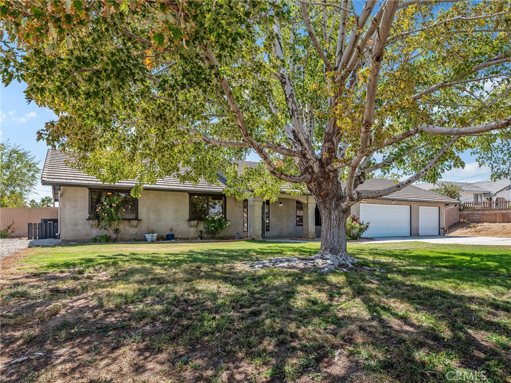 SPECTACULAR BUY IN HESPERIA!.........New Septic-New A/C-New Baths with Gorgeous White Countertops-New Flooring-Newly Painted Kitchen Cabinets and Fresh Paint and New Lighting Fixtures Throughout this Home. Stone Fireplace for cozy nights, Tile Roof, Triple Garage, Huge 24,700 sq/ft backyard with chainlink fencing situated on a corner lot. Close to shopping, pharmacy and dining. MOVE-IN-Ready----Come See It Today!! All information is deemed reliable but not guaranteed.