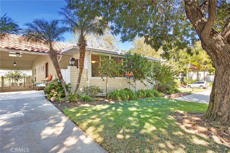 NO STAIRS to this beautifully remodeled single-level home in the guard-gated Laguna Woods Village community. This END-UNIT lives more like a private cottage than a condo, offering the rare benefit of no one above or below you and a convenient carport plus guest parking just out front.



Completely reimagined with walls moved and the floor plan expanded for improved functionality, storage, and flow. The primary suite was enlarged and reconfigured for better livability, and the guest bedroom was widened by about a foot with a larger closet — creating a comfortable space for guests or a home office.



The open-concept kitchen features an impressive center island with pendant lighting that offers bar seating and ample storage, granite countertops, a large skylight for natural light, and upgraded stainless-steel appliances including a Bosch dishwasher, range with built-in air fryer, and full backsplash.



Additional features include rich wood laminate flooring throughout, LED dimmable lighting, crown molding, high-end dual-pane windows, five ceiling fans, and a full-size in-home washer and dryer. The Smart Home system allows you to control lights, temperature, and the August keyless front door using Alexa or Google.



The enclosed front patio adds approximately 200 square feet of additional living space — ideal for hobbies, office use, or relaxation. Freshly painted interior the home feels bright, modern, and warm while preserving its traditional charm.



Residents enjoy access to Laguna Woods Village’s resort-style amenities: five pools, three fitness centers, ten tennis courts, multiple pickleball courts, over 200 clubs (including one of the largest Bridge Clubs in California), arts studios, and performance spaces. The community is professionally managed with guard-gated security, and the monthly HOA fee includes exterior maintenance, yard and landscape maintenance, water, trash, and basic cable — a hallmark benefit of the Laguna Woods Stock Cooperative structure. This is an Active Adult 55+ lifestyle all of its own, even including bus transportation.



With its private setting in Nob Hill, close to the Aliso Creek Trail, thoughtful redesign, and unbeatable amenities, this home offers an exceptional opportunity to enjoy one of Orange County’s premier active-adult communities.