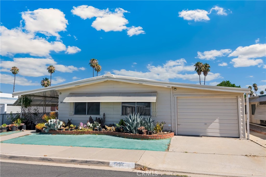 Welcome to this spacious home located in the desirable Sierra Dawn Estates, a vibrant 55+ community where you own the land. This home features 3 bedrooms, 2 bathrooms, a bonus room addition that could easily serve as a 4th bedroom, a sunroom, and a garage complete with a dedicated workshop area – perfect for hobbies or extra storage. Step inside to a bright and open living room that seamlessly flows into the kitchen and formal dining area with sliding glass doors that lead into the sunroom. The third bedroom offers private access to the sunroom, making it ideal for guests or a home office. You’ll appreciate the indoor laundry with plenty of storage throughout the home.
Sierra Dawn Estates offers resort-style living with 5 swimming pools, 4 jacuzzis, 4 clubhouses, a gym, RV parking (for a nominal fee), a dog park, billiards room, and 2 indoor shuffleboard courts, plus a full calendar of social events and activities. Don’t miss your opportunity to own this gem in one of Hemet’s most active and well-equipped communities. Schedule your showing today before it’s gone!