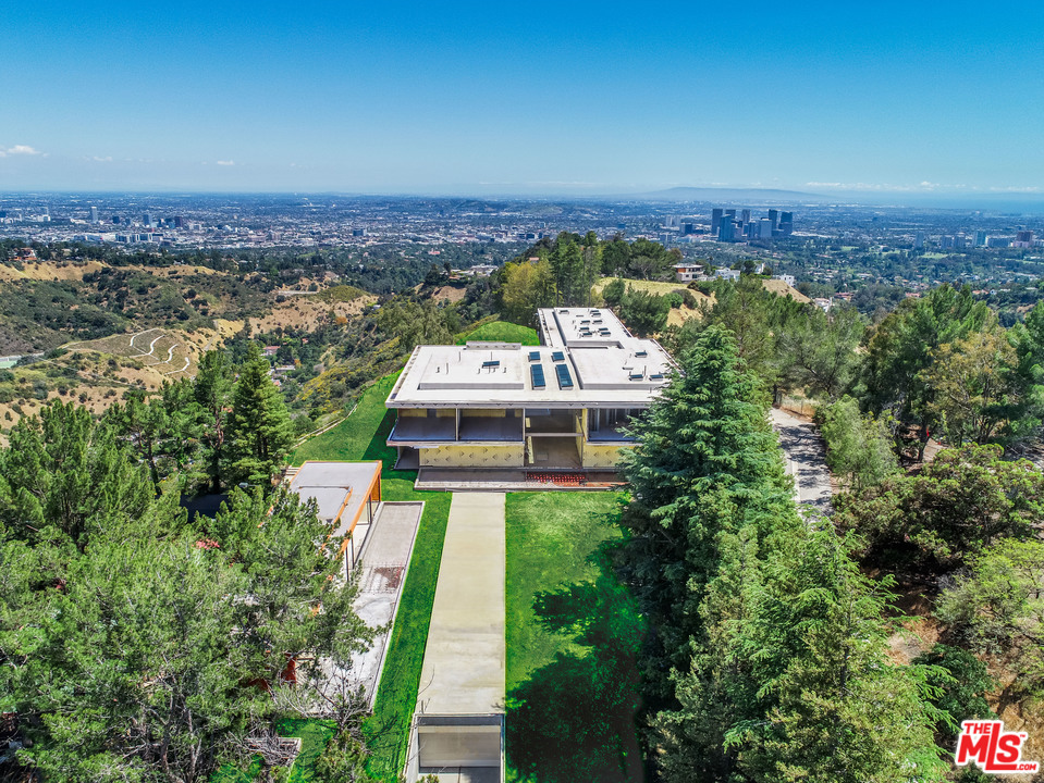 Back on Market, buyer did not perform! This amazing Beverly Park offering is a once in a lifetime opportunity with approved plans and permits with RTI status. Perched on a gated promontory with city to ocean views, incredible privacy and security this was formally the estate of iconic producer Darryl Zanuck. 16 Beverly Park was entrusted to renowned designer Steve Hermann, who envisioned a world-class architectural estate for the site. His objective was to design one of the most distinctive and exquisite residences of its kind. Now approximately 70% completed and plans and permits approved to finish, this ultra-luxurious compound is ready for a buyer with vision. The compound includes a guard house, guest house, residence, theater, pool, tennis court and extensive underground parking. Anticipated to make its mark on the list of fabulous estates for years to come, this is truly a "trophy" for a connoisseur.