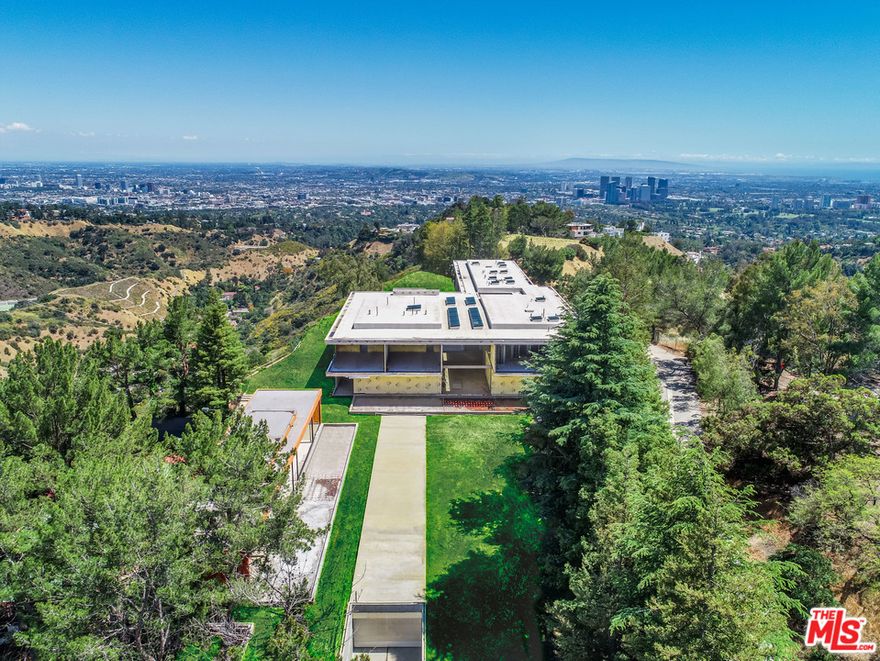 Back on Market, buyer did not perform! This amazing Beverly Park offering is a once in a lifetime opportunity with approved plans and permits with RTI status. Perched on a gated promontory with city to ocean views, incredible privacy and security this was formally the estate of iconic producer Darryl Zanuck. 16 Beverly Park was entrusted to renowned designer Steve Hermann, who envisioned a world-class architectural estate for the site. His objective was to design one of the most distinctive and exquisite residences of its kind. Now approximately 70% completed and plans and permits approved to finish, this ultra-luxurious compound is ready for a buyer with vision. The compound includes a guard house, guest house, residence, theater, pool, tennis court and extensive underground parking. Anticipated to make its mark on the list of fabulous estates for years to come, this is truly a "trophy" for a connoisseur.