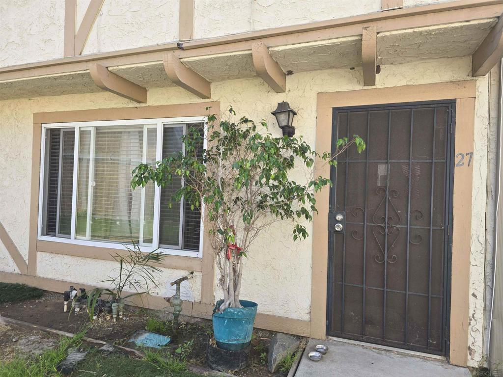Value Range $350,000–$375,000 – Investor Opportunity with Reliable Tenant in Place. This well-maintained townhome offers a functional layout with durable finishes and income-generating potential. The living room and upstairs bedrooms feature wood laminate flooring, while the kitchen and bathrooms are finished with easy-care tile. The open kitchen and dining area includes granite countertops, a decorative backsplash, a ceiling fan over the dining space, and essential appliances such as a refrigerator and dishwasher. Dual-pane sliding glass doors lead to a private back patio, perfect for low-maintenance outdoor enjoyment. A half-bath is located on the main floor for added convenience. Upstairs, both bedrooms include mirrored closet doors, with a walk-in closet in the primary. The full bathroom features granite countertops and practical finishes. Additional features include an in-unit washer/dryer hookups, and a location near the community playground. This property is a great fit for investors — it is currently occupied by an established tenant paying $2,700 per month, and the tenant would like to stay, offering immediate rental income with stability.