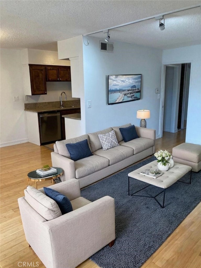 $10k price adjustment. Excellent opportunity to own in a prime Studio City location, short distance from the "Silver Triangle". Large 1 bedroom/1 bath unit, located at the back of the building away from the main street and overlooking an inviting pool. Adjacent to the pool, you will find a serene patio area with BBQ. The large living room has a fireplace and opens up to a separate dining area and galley style kitchen. New tile flooring in Kitchen and Bathroom. Brand new Kitchen appliances. Updated Bathroom with new vanity and lighting. Spacious bedroom with large closet and built-in closet organizer. Additional closet and linen closet are in the hallway. One assigned-secured parking space with additional storage and community laundry really make this an incredible value. Small building, only 23 units, and LOW HOA dues. Close to shopping, restaurants, and easy access to Ventura Blvd and the 101 FWY, this unit is the perfect oasis in the middle of the city!