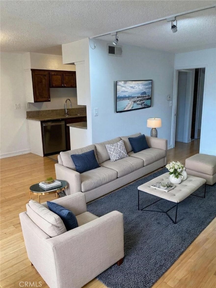 $10k price adjustment.  Excellent opportunity to own in a prime Studio City location, short distance from the "Silver Triangle". Large 1 bedroom/1 bath unit, located at the back of the building away from the main street and overlooking an inviting pool. Adjacent to the pool, you will find a serene patio area with BBQ. The large living room has a fireplace and opens up to a separate dining area and galley style kitchen. New tile flooring in Kitchen and Bathroom. Brand new Kitchen appliances. Updated Bathroom with new vanity and lighting. Spacious bedroom with large closet and  built-in closet organizer. Additional closet and linen closet are in the hallway. One assigned-secured parking space with additional storage and community laundry really make this an incredible value. Small building, only 23 units, and LOW HOA dues. Close to shopping, restaurants, and easy access to Ventura Blvd and the 101 FWY, this unit is the perfect oasis in the middle of the city!