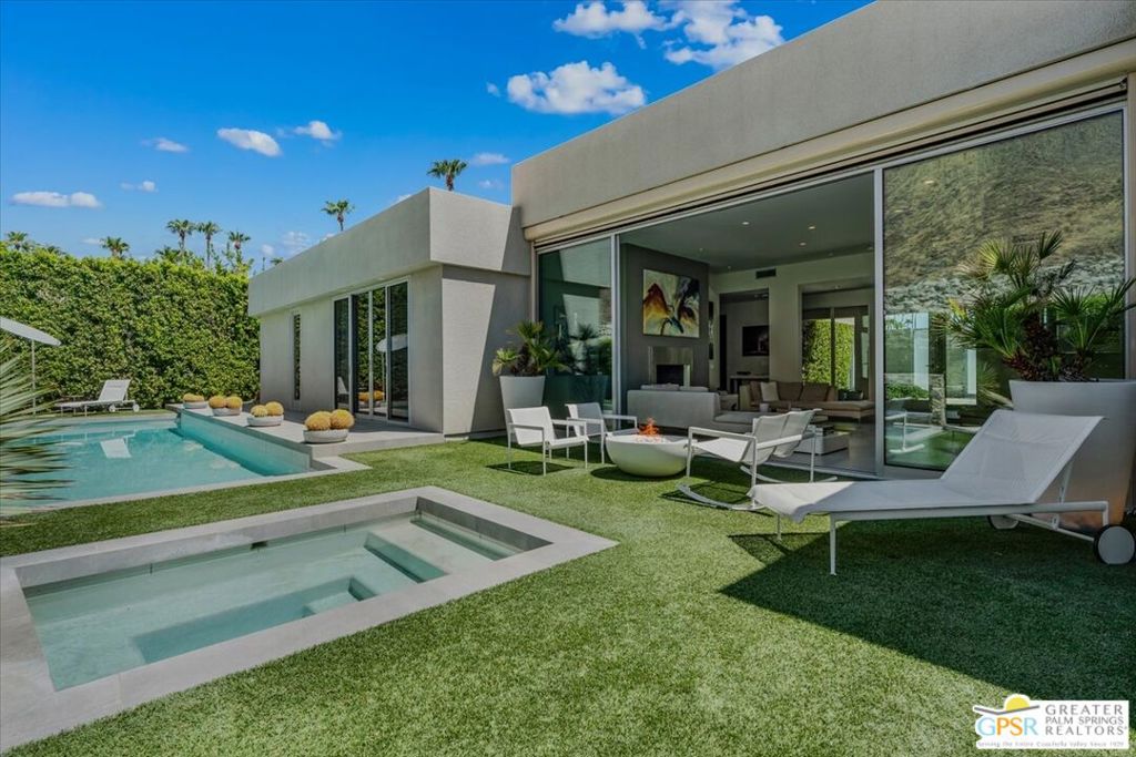 The sought-after Palm Springs neighborhood of Vista Las Palmas lies just west of downtown and the gated "Vista Los Robles" enclave is nestled at the western edge of Vista Las Palmas up against the San Jacinto mountains. 1175 Los Robles is one of these homes and is the perfect desert retreat providing quiet solitude only minutes from the exciting amenities of Palm Springs. The enclosed courtyard entry complete with desert landscaping provides a gateway to this beautifully remodeled and impressive space where at once the backdrop of the mountain becomes the focal point. The spacious open living area features a sunken living room with floor-to-ceiling windows opening up to the outdoors where the pool, spa, fire pit and BBQ beckon. The substantial and bright chef's kitchen is equipped with sleek stainless steel appliances (including 2 dishwashers) and two islands that provide space for entertaining in the open living/dining area only steps to the oasis outside. A stylish powder room and secluded den/office/media room lead the way to the bedroom corridor. The generous primary suite opens up to the beautifully landscaped and appointed pool and spa dominated by the western view of the mountain. Two additional ensuite bedrooms complete the thoughtful design of the 3,000+ square foot expansive solar-powered sanctuary. The peaceful serenity of this home offers the quintessential desert escape -- seclusion, security, and proximity to the desert's many attractions. Los Robles Drive is gated for security and is an 11-home cul-de-sac with a gated entrance. The lease includes water, weekly housekeeping, gardening and pool/spa service. PLEASE NOTE: the home is leased/occupied 4/18/25 thru 10/18/25 AND 12/28/25 thru 3/31/26.