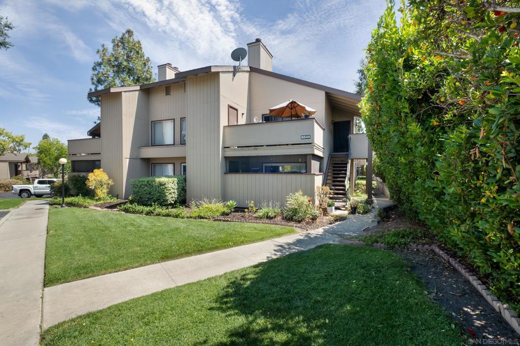 Welcome to this beautifully maintained single-level condo, where pride of ownership shines throughout. Thoughtfully upgraded and move-in ready, this home features elegant crown molding, an updated kitchen with modern finishes, and a convenient eat-at counter perfect for casual dining or entertaining. Bedrooms are located on opposite sides of the unit. Enjoy the privately enclosed patio. The dining area is highlighted by custom lighting that enhances the inviting ambiance, while both bathrooms have been tastefully remodeled with quality finishes and contemporary design. A full-size, side-by-side washer and dryer are tucked neatly into an in-unit laundry closet, adding comfort and convenience to your daily routine. Situated close to shopping, banking, restaurants, SDSU, and scenic Lake Chollas, this location offers easy access to both urban amenities and tranquil nature. One assigned parking space adds convenience and ease to daily living. Community amenities include a sparkling pool, relaxing jacuzzi, dog park, and ample guest parking. Whether you’re taking a stroll to Lake Chollas or hosting friends at home, this charming condo blends convenience, comfort, and style in one perfect package.