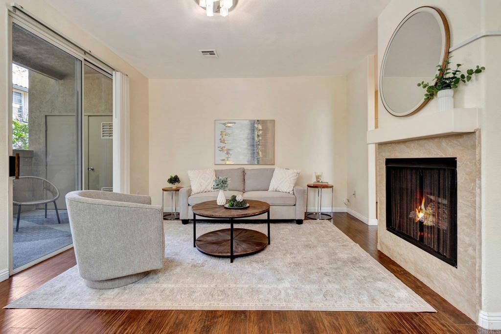 Step into this beautifully maintained 2-bedroom, 2-bath condo that effortlessly blends comfort and convenience. Located in a desirable community with resort-style amenities, this home offers the ideal setting for relaxed Southern California living. Enjoy cozy evenings by the charming fireplace in the open-concept living room, or whip up your favorite meals in the well-appointed kitchen with ample counter space and storage. The spacious primary suite features a private en-suite bath and generous closet space, while the second bedroom is perfect for guests, a home office, or both. Unwind on your private balcony or take advantage of the community amenities including a sparkling pool, spa, & fitness center. With in-unit laundry, 2 assigned parking spaces, and a prime location close to shopping, dining, and freeway access, this home has everything you need and more. This condo is a rare find. Come see it today and imagine yourself living the easy, breezy lifestyle you deserve!