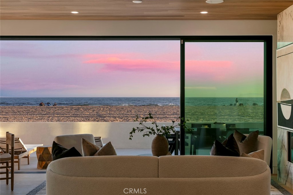 Modern Masterpiece on the Sand — Newport Beach’s Crown Jewel. Introducing 5007 Seashore Drive — a striking, newly completed oceanfront estate that redefines luxury coastal living. Perfectly positioned on the sand in one of Newport Beach’s most desirable stretches of shoreline, this architectural gem offers an unrivaled beachfront lifestyle with panoramic ocean vistas from every level. Step inside and experience cutting-edge design, open-concept living, and walls of glass that erase the line between indoors and out. From the sleek, contemporary finishes to the curated floor plan crafted for effortless flow, every detail has been considered to capture the essence of seaside sophistication. A true entertainer’s dream, the expansive rooftop deck—spanning over 750 sq. ft.—delivers unobstructed sunset views and the perfect backdrop for oceanfront dining, lounging, or stargazing under the Pacific sky. Brand-new construction, ultra-rare location, and direct beach access — this is a once-in-a-generation opportunity to own a front-row seat to the ocean in Newport Beach. Enjoy World class Shopping and Dining with Nobu Newport beach and the Balboa bay resorts just minutes away.
