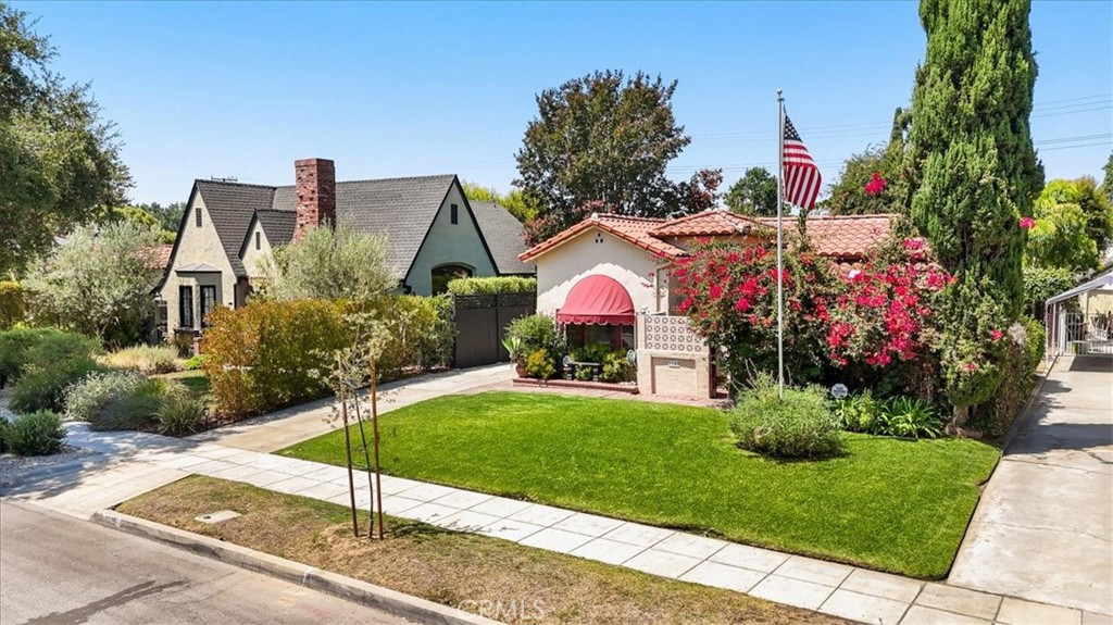 Nestled on a quiet, tree-lined street in the heart of Alhambra, this single-story Spanish-style home—built in 1930 and lovingly held by the same family for 63 years—radiates charm, comfort, and possibility. From the moment you arrive, you’ll be drawn in by its curb appeal and timeless character.
Inside, the grand living room welcomes you with soaring beamed ceilings, a striking fireplace, and sunlit picture windows. The formal dining room boasts beautiful hardwood floors and intricate period details, offering an elegant setting for gatherings.
The bright and inviting kitchen features a cozy breakfast nook and built-ins, and connects to a practical laundry/mudroom with direct access to the backyard. Three spacious bedrooms and two bathrooms adorned with original vintage tile create a functional and well-balanced floorplan.
A California utility basement houses the furnace and offers excellent storage, along with convenient access to the home’s plumbing and electrical systems—a rare and valuable feature in homes of this era.
The expansive backyard is lush and private—perfect for relaxing, entertaining, or reimagining the space. With alley access and a detached two-car garage at the rear of the property, this home presents a rare opportunity for future development, whether it’s adding an ADU, expanding the footprint, or exploring other creative possibilities.
Conveniently located near top-rated schools, shopping, dining, parks, and transportation, this unique property offers the ideal blend of historic charm and modern potential.