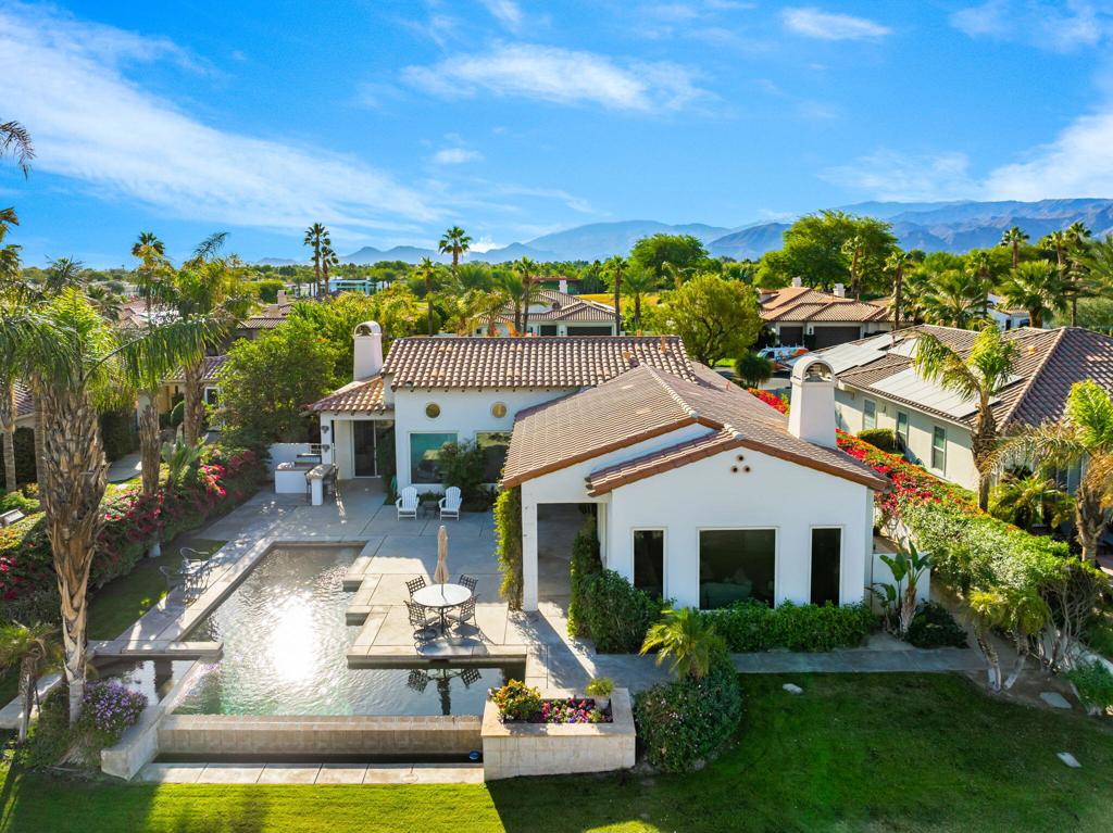Don't miss this! Professionally remodeled from top to bottom. Situated on a prestigious golf course. Inside, you'll find a meticulously designed interior with sleek finishes, modern furnishings, and high-end details throughout. Kitchen features all new appliances, a chef's paradise. The spacious living areas boast breathtaking views of the golf course and surrounding mountain landscape, framed by expansive windows that flood the home with natural light. The master suite is a true sanctuary, complete with a luxurious spa-style bathroom, his & hers walk-in closets, and private access to the outdoor spaces. Each additional bedroom offers en-suite baths and ample space for guests or family. Step outside to your personal oasis, where a large infinity pool overlooks the golf course, creating a seamless connection between luxury and nature. Relax on the patio, entertain guests, or enjoy a round of golf. With new air conditioning, appliances, and every modern amenity, this home is designed for effortless living. Don't miss this rare opportunity to own a move-in-ready masterpiece, with everything you need to live the ultimate lifestyle. Legacy ownership includes Mission Hills Country Club social/fitness membership. Furnishings available outside of escrow.