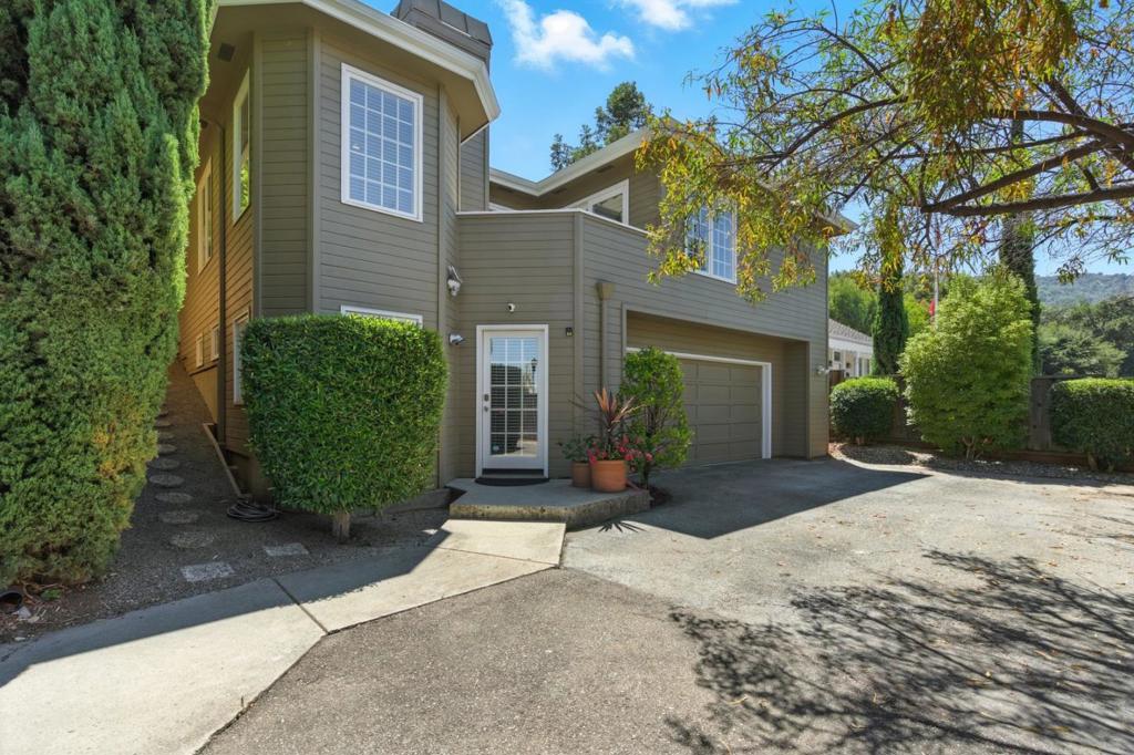Discover the perfect blend of comfort, style and convenience in this beautifully updated Saratoga residence. Nestled in the heart of historic Saratoga Village, this home is walking distance from downtown, where you'll enjoy Michelin-starred dining, wine tasting rooms, cozy coffee shops, unique boutiques, and art galleries. Ideally situated along Big Basin Way, it offers proximity to scenic parks, hiking trails and renowned concert venues such as Montalvo Arts Center and the Mountain Winery all while providing an easy commute to Silicon Valley. Split level home with one bedroom and one full bathroom on the lower level with its own private entrance ideal for in-laws, guests or IHHS, Upstairs living includes two spacious bedrooms and a full bathroom with dual vanities and oversized shower. Living room with wood-burning gas fireplace, vaulted ceilings, and recessed lighting, Kitchen with stainless steel appliances to include gas range, double oven, dishwasher, and tile countertops, Eat in Kitchen area, Updated bathrooms, Fresh interior paint creates a bright inviting atmosphere, Hardwood flooring throughout, Inside laundry with ample storage, Mature trees surround the property for privacy and a serene setting, New composition roof with new gutters and downspouts