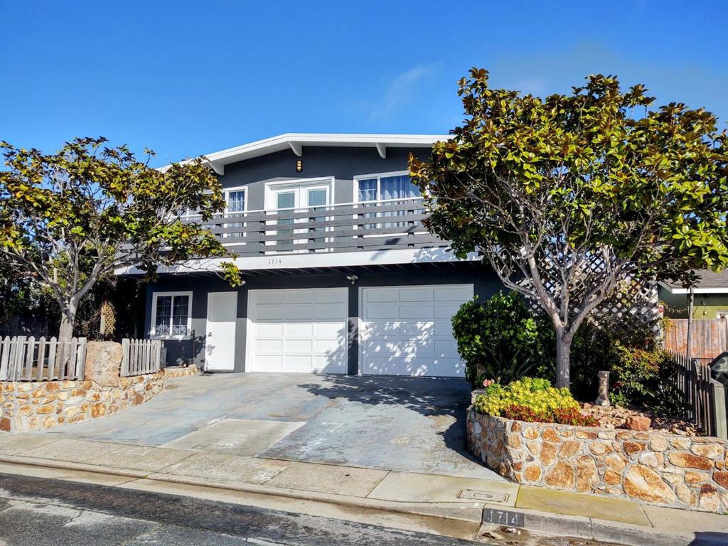 Stunning Bay & Ocean Views. Nestled in the heart of Seaside, this charming 4-bedroom, 3-bathroom home framed by two mature magnolia trees along with Carmel stone pathways and walls adding timeless curb appeal. With 1,610 square feet, this thoughtfully designed home features an open & light kitchen, breakfast bar and dedicated dining area. The cozy living room boasts a fireplace for warm, relaxing evenings, while a mix of wood, tile, and carpet flooring creates a stylish and comfortable ambiance throughout. Ceiling fans provide a cooling breeze in the main living areas. There is a spacious utility storage area, providing ample room for seasonal items, outdoor gear, or a home workshop. Having a spacious two-car garage with extended driveway for extra parking is a rarity in the area. The landscaped 3,650 SF lot is ideal for pets, play, or entertaining. The roof was replaced about 4 yrs ago, house recently painted and the sewer line was recently replaced, for peace of mind. Located in the Monterey Peninsula Unified School District and just minutes from stunning beaches, scenic trails, world-class dining, and shopping, this home blends comfort, convenience, and coastal charm. Dont miss this incredible opportunity.