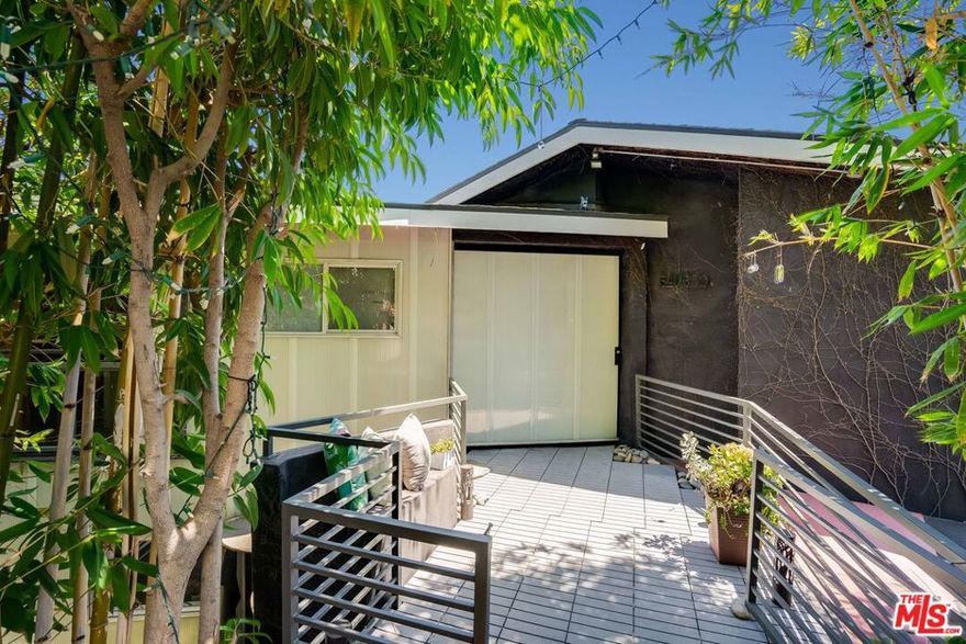 Unlock your opportunity to own a rare, revenue-generating canyon home in the enchanting Hollywood Hills. Nestled in the heart of Beachwood Canyon, this nearly 3,000-square-foot residence blends asian inspired serenity with modern industrial flair and sweeping views from every room. Ideal for creative buyers seeking a property that can offset their mortgage or generate steady income, this licensed Airbnb-ready home offers proven earning potential and versatile living arrangements. Currently, the owners live in the hillside residence and self-manage the Airbnb rentals, leasing portions of the home while maintaining privacy and functionality. For those seeking a single-family home with character, space, and the opportunity to add value with vision, this is an exceptional find. A private entrance lined with tall bamboo, a charming footbridge, and lush landscaping sets the tone for the tranquil experience of the home. The living room captivates with dramatic panoramic views of the Hollywood Hills, Griffith Observatory, Downtown LA, and the Hollywood Sign. The open-concept main level features a kitchen and dining area that flow seamlessly onto a view-filled balcony  perfect for morning coffee or evening wine. The playful pink junior suite offers an ensuite granite shower and access to a private garden patio that could be converted to a second balcony.  A second updated bathroom with modern concrete finishes completes the main floor. Downstairs, two guest-ready bedrooms await, including the primary suite, which features a granite shower, private garden, and wrap-around decks with breathtaking hillside views. The lower level adds flexibility with a secondary prep kitchen, a cozy den, and a third bedroom currently used as a writer's retreat  a space that inspires creativity with its enchanting canyon backdrop. With two separate entrances, the lower level offers potential for a JADU conversion or independent guest quarters. Designed for both lifestyle and income, the home's layout includes four distinct guest suites, each with its own sense of privacy and charm. Shoji-style doors, artisan metalwork, polished concrete and timber floors, koi ponds, and multiple decks for outdoor lounging create a truly immersive aesthetic rooted in Wabi Sabi-inspired design. A third lower-level deck features an Endless Swim Spa (currently in need of updating) positioned to capture commanding, one-of-a-kind views of the Hollywood Sign  an iconic backdrop. This home has a strong rental history, generating over $100K annually across Airbnb and rental platforms. Historic rental rates ranged from $3,000-$4,800 per month per unit, with consistent six-figure returns. Additional highlights include a gated driveway with ample guest parking, an attached two-car garage, three tankless water heaters, and a comprehensive security system. Perfect for end users, investors, or owner-operators, this home offers unique versatility as a private creative sanctuary that doubles as a thriving income property.  More than a home, it's a living, breathing hospitality experience set amid the timeless beauty of the Hollywood Hills.