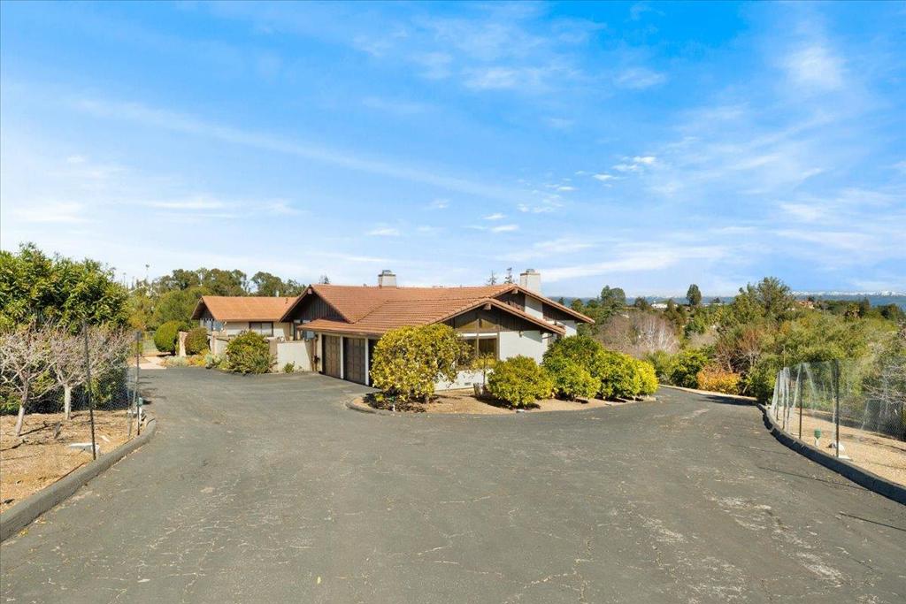Looking for a large property in a great Los Altos Hills location? This might just be the one. This home needs remodeling throughout, but it is worth the effort. The property sits on a secluded 1 and a 1/4 acre lot with beautiful views of the surrounding hills and mountains. Wonderful views are available from many locations such as: the kitchen, dining room, living room and the spacious primary bedroom. The property features a 6 car garage with additional room for large vehicles like boats and or RVs. There is a spacious lower level that has a kitchen, full bathroom, additional living room, large fireplace and a huge storage room that perhaps can be converted into an additional bedroom (possible ADU). This one is a must see!