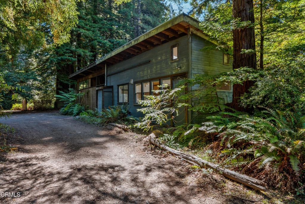 Tucked away on 2.26 acres just outside of Fort Bragg, this property offers a peaceful country setting with convenient access to town. The land is framed by beautiful redwoods and features a sunny garden area, creating an inviting backdrop for the multiple living spaces. The workshop includes a two-bedroom, one-bath residence. Adding to the appeal is a classic redwood studio cabin built in 1955, complete with its own kitchen and bathroom. An additional studio offers even more flexibility, whether for a home office, yoga or meditation space, or guest accommodations. With its combination of privacy, natural surroundings, and versatile living options, this property represents a rare opportunity on the Mendocino Coast.