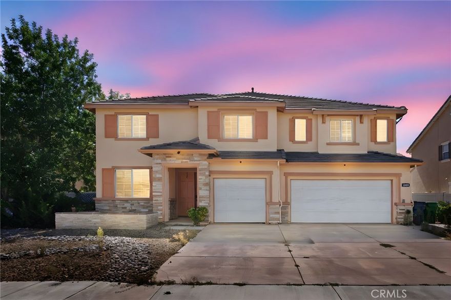 This beautifully finished home offers generous living space and modern comfort throughout. Featuring a bright and open floor plan, the home includes both formal and casual living areas perfect for entertaining or relaxing. The kitchen features ample cabinetry, a large island, and seamless flow to the dining and family room areas. Upstairs you’ll find well-sized bedrooms, an open living area with office space, and a spacious primary suite with a private ensuite bath and shower. The potential 6th bedroom has been converted to a full walk-in closet space for those looking to store an extra wardrobe, creating flexibility and options for growing or larger households. Enjoy Southern California living in the private backyard, ideal for gatherings and festive meals. Additional highlights include a 3-car garage, central air and heat, and convenient proximity to parks, schools, and shopping. This house is ready for those wanting an open, blank canvas, and those simply looking for an upgraded amount of space and comfort!