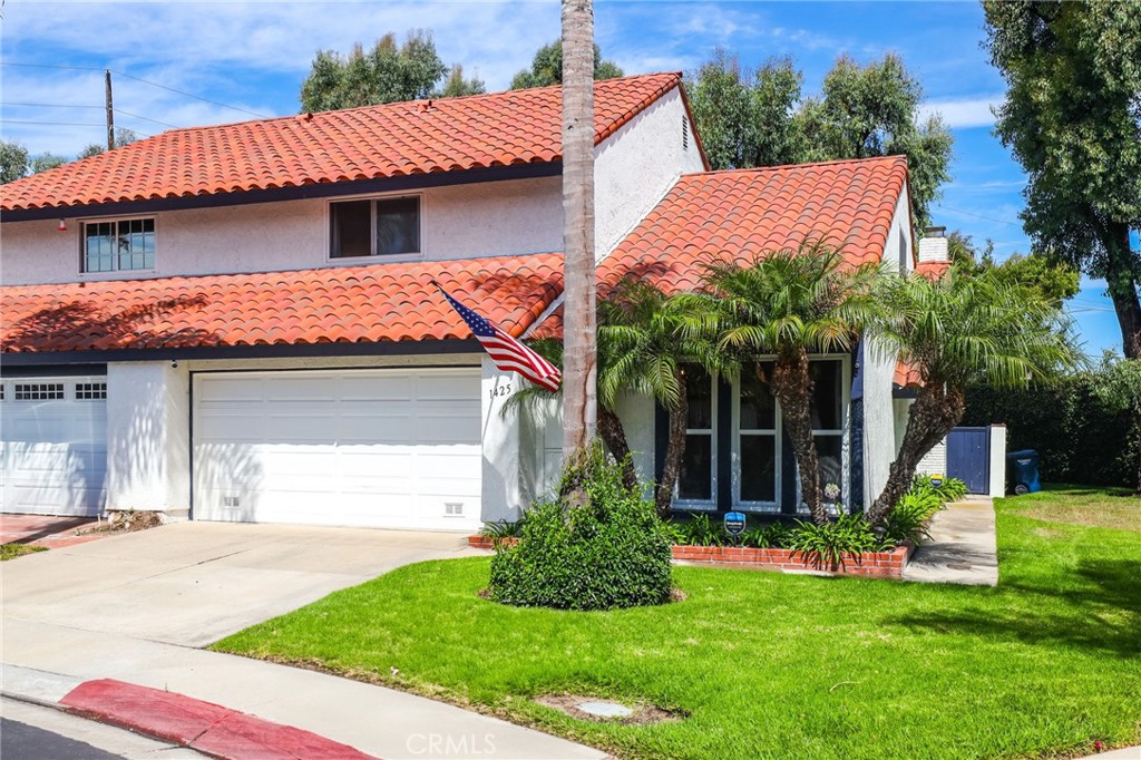 There is no other way to put this. THIS IS A RARE OPPORTUNITY. 1425 Alpine Lane is tucked away in the quiet coastal community of La Cuesta Racquet Club. However, this isn’t your typical townhome. This home is in a RARE corner location within the community that allows you to have a popular end unit model (sharing only one common wall) AND a secluded back patio that opens up to a large green space with beautiful landscaping that feels like a private yard that you don't maintain. Let’s not end there. 1425 Alpine also includes a large 2 car driveway in addition to its 2 car attached garage, something that is not typical in this community. Just ask the neighbors how rare that is! Entering the home, you’re greeted by a large living space with tall ceilings, accented by skylights that allow plenty of natural light to pour in. Enjoy laid back evenings relaxing around the fireplace, taking in your favorite show or game. Make your way into the kitchen and you’ll find plenty of space for preparing meals and serving them up at the breakfast bar. Or if you’re looking for something more formal then take a seat in your dining area or even out on your covered patio. From the kitchen you can access the garage as well as the laundry area. Another highlight of this floor plan is that it has a downstairs master bedroom with an ensuite. Located upstairs are two additional bedrooms that are larger than standard size, a full bathroom, and a private loft with tall ceilings which can be converted into a 4th bedroom. Other perks include a newer furnace and the whole home was fumigated in 2023. The community is professionally managed, continues to maintain one of the lowest HOAs in the area @ $310/month, and includes high-speed internet and cable. Also within the community there are multiple green spaces as well as a clubhouse and tennis court. Don’t miss your chance to live in a quiet community this close to Downtown HB and the ocean.