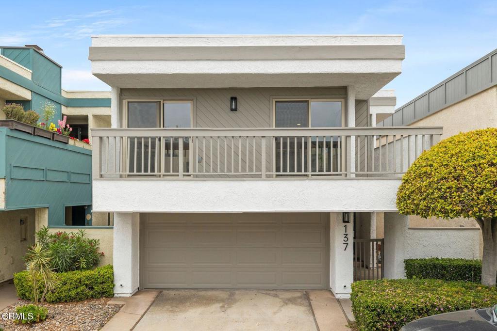 Just steps to the sand, and situated within the private gates of Anacapa View Beach Homes, sits this FULLY renovated and stunning single family home- and just in time for Summer! You'll feel on vacation everyday in this prime west facing residence, enjoying the absolute best of beach living- a cool Pacific breeze, all day sunlight, gorgeous sunsets, and of course the option for a daily beach walk! Completely redesigned with a modern coastal vibe, the highly upgraded home presents a crisp white interior, new light oak vinyl plank flooring, and all new elevated fixtures throughout. The well designed floor plan provides a convenient first level bedroom with exterior access, updated full bathroom, individual laundry room, PLUS a bonus room- a great extra space ideal for a home gym, yoga studio, office, or even additional bedroom. Head up to the light and bright main level complete with an open concept layout, multiple skylights, welcoming warm natural light, and brand new kitchen beautifully appointed with custom cabinetry & hardware, stainless appliances, quartz countertops, utility sink, all new fixtures, zelige tile backsplash, and expansive counter bar - perfect for hosting friends and loved ones after a day at the beach! The kitchen ideally overlooks both the dining & living room, that not only centers around the modern fireplace, but also the dual sliders optimized for a peek-a-boo ocean view & direct access to the wrap around balcony. Down the hall are 2 additional well sized bedrooms, brand new FULL guest bathroom, as well as the primary suite featuring exterior sliders to the back patio (and direct access to the community pool & spa!), walk in closet and fully renovated ensuite bathroom. Additional highlights include fresh exterior paint, all new recessed lighting, brand new furnace, and convenient attached 2-car garage access. Whether you're seeking a full time beach home, or a turn-key coastal weekend getaway, you don't want to miss this one!