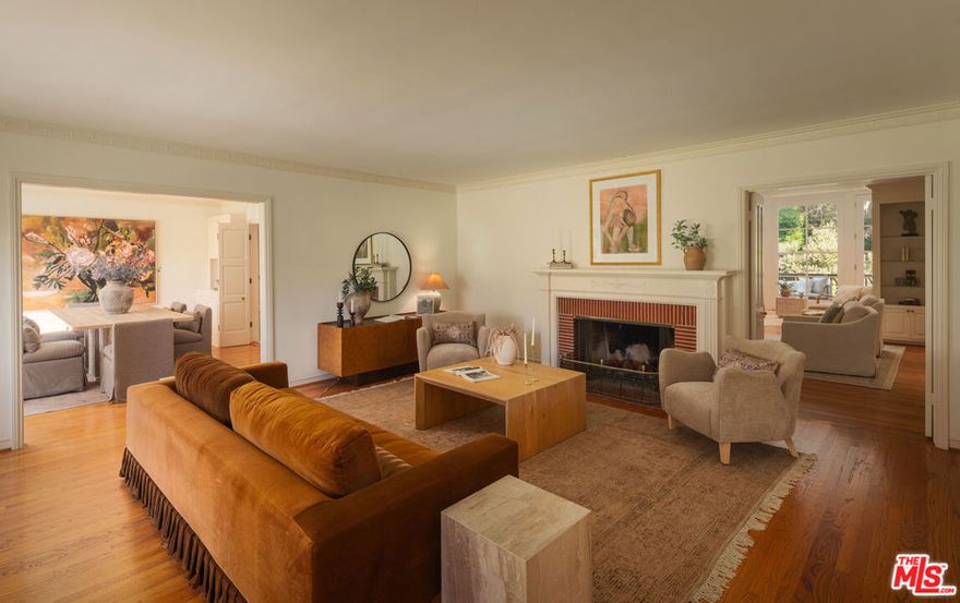 Tucked away on a quiet cul-de-sac in prime Brentwood, this charming traditional sits on a nearly 11,000 sq ft lot surrounded by mature trees and lush greenery. The expansive, sun-filled yard features a sparkling pool and a tranquil setting that feels worlds away from the city. Move-in ready as is or take advantage of the permitted plans for a major addition. A rare opportunity to enjoy or enhance a property in one of Brentwood's most sought-after locations - and an additional opportunity to take advantage of the fully permitted plans.