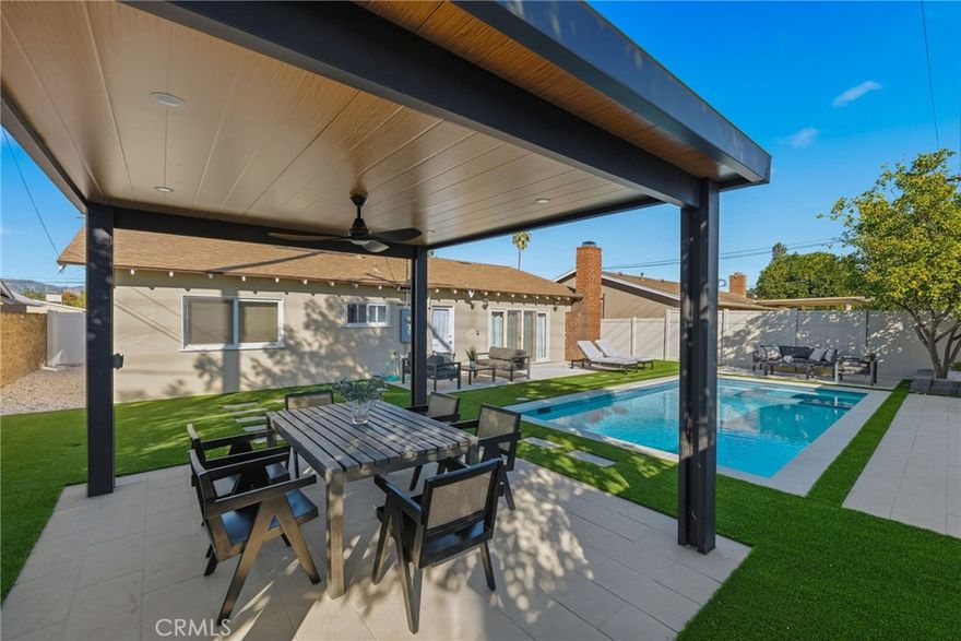 Welcome to this stunning move-in-ready home, perfectly situated on a spacious, flat lot in a quiet, tree-lined neighborhood. Thoughtfully updated throughout, this single-story residence offers modern comfort, timeless charm. Step inside the main home to a bright, open floor plan where a cozy fireplace creates a natural divide between the living and family rooms. The remodeled kitchen is a true centerpiece, featuring quartz countertops, a large island with bar seating, subway tile backsplash, stainless steel appliances, and custom cabinetry all with convenient access to the backyard. French doors open to a peaceful outdoor retreat complete with fruit trees, a lush grassy yard, and a covered patio perfect for relaxing or entertaining. The spacious bedrooms provide plenty of comfort, while the beautifully updated bathrooms boast a floor-to-ceiling tiled shower and a soaking tub with sleek modern finishes. With excellent curb appeal and major upgrades already done, this West Hills treasure combines style, flexibility, and convenience in one perfect package. Don’t miss this rare opportunity to call Hartland home!