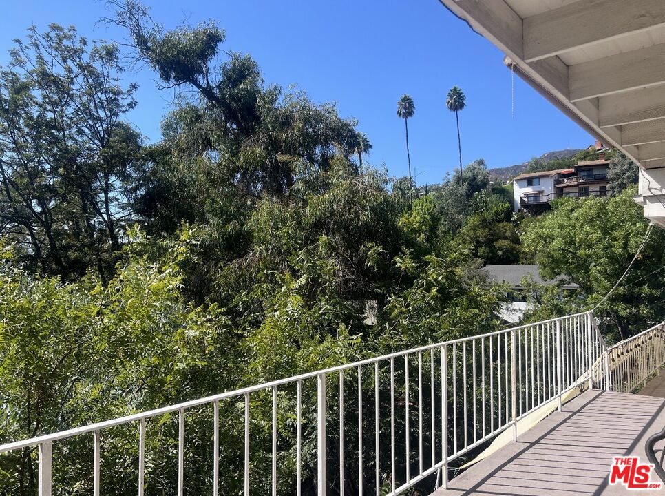 Inspiring Glendale Hillside Retreat 3-Bedroom, 3-Bath Gem with Breathtaking ViewsExperience the perfect blend of mid-century charm, modern comfort, and serene hillside living in this beautifully updated Glendale Hills home. Nestled in a quiet and peaceful neighborhood, this 3-bedroom, 3-bath single-family residence offers majestic city and nature views that will inspire you every day.Start your mornings with a cup of coffee on the long balcony, listening to the birds sing while soaking in lush greenery and panoramic vistas. By evening, cozy up by the front yard fireplace seating or enjoy the warm glow of the indoor fireplace as sunsets paint the hillside in vibrant colors.The home features a spacious, rectangular floor plan perfect for both relaxation and entertaining. The primary bedroom includes a bonus office room, ideal for remote work or study, while additional bedrooms and a family room provide ample space for guests or creative pursuits. An attached 2-car garage, central AC, in-unit laundry, and resort-like outdoor living areas enhance comfort and convenience.The lower level offers a separate tenant unit with condo-style privacy, perfect for extended family or rental opportunities. Entertain friends on the expansive deck with sweeping views, or enjoy a quiet moment on the outdoor breakfast table. Utilities including electric, water, gas, and Wi-Fi are included, simplifying modern living.Location is GREAT!!! Just 5 minutes to The Americana at Brand, Trader Joe's, Ralphs, and Downtown Glendale, with easy access to major freeways (2, 5, 134, 210).Whether you're seeking peace, inspiration, or a stylish home to call your own, this Glendale Hills hillside retreat offers it all. Opportunities like this are rare schedule your private showing today and make this stunning home yours.