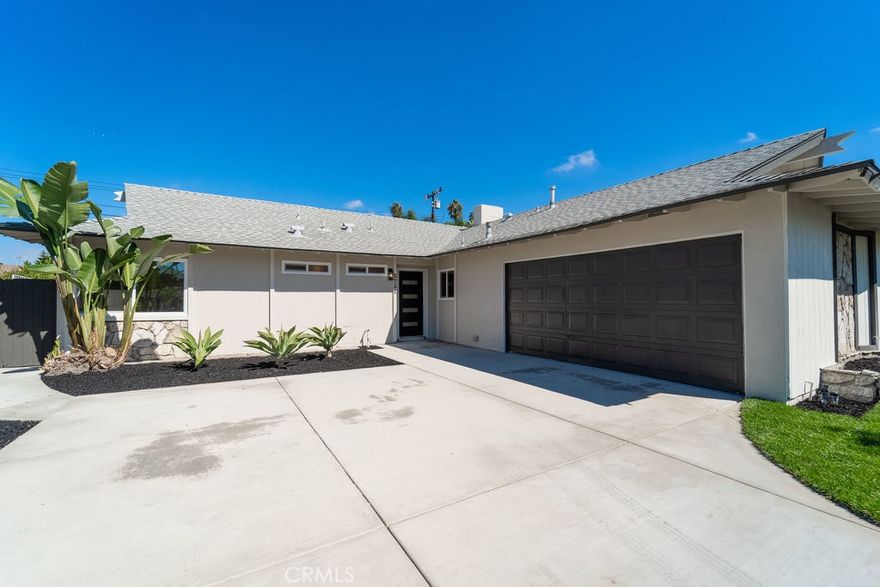 Welcome to 5751 Mangrum, a fully reimagined single-story residence showcasing 4 bedrooms and 3 bathrooms across 1,670 sq.ft. of thoughtfully designed living space on a 6,500 sq.ft. lot. Every inch of this home has been transformed, blending modern style with everyday comfort, all just minutes from the beach, Meadowlark Golf Course, and Huntington Beach’s favorite shops and dining spots.

Step inside to an open, sun-filled layout highlighted by wide-plank floors, recessed lighting, and a cozy fireplace anchoring the main living area. The heart of the home is the show-stopping chef-inspired kitchen, beautifully remodeled with custom cabinetry, quartz countertops, stainless-steel appliances, and a built-in gas grill that makes indoor-outdoor entertaining effortless.

The private primary suite offers a spa-inspired bath with dual vanity and a spacious walk-in shower. Three additional bedrooms provide versatility for family, guests, or a home office, while each of the home’s three updated baths features sleek, modern finishes.

The refreshed front yard includes new sod and an efficient irrigation system for easy maintenance. In back, a generous yard awaits your personal touch—ready to become a play area, entertainer’s retreat, or tranquil garden escape.

Families will appreciate proximity to top-rated Huntington Beach schools, including Village View Elementary, Spring View Middle, and Marina High School, all just minutes away.

Additional highlights include a finished two-car garage, new interior and exterior paint, new flooring throughout, fully remodeled kitchen and baths, and included patio furniture.

Stylish, functional, and move-in ready, 5751 Mangrum delivers the complete Huntington Beach lifestyle, modern design, coastal convenience, and room to make it your own.