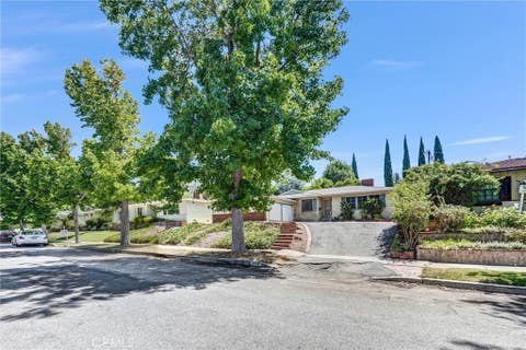 Photo of 9818 Creemore Drive, Los Angeles, CA 91042 (MLS # GD26153714)