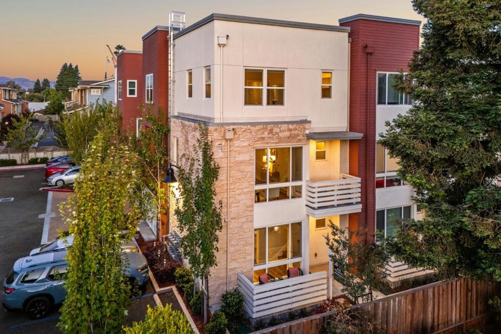 Quiet complex at the heart of Sunnyvales tech sector. This four-bedroom, three full bathroom condo offers a flexible first-floor space to house a fourth bedroom or study. Spanning 1,642 square feet, this like-new build offers an open floor plan where living, dining, and kitchen flow seamlessly from one light-soaked space to the next. Featuring a modern kitchen with glossy Quartz countertops, subway tile backsplash, and stainless-steel appliances, the tri-level condo continues upward to a trio of generous bedrooms, including a sunny master suite with vaulted ceilings. The unit includes a two-car garage and a private patio. Conveniently situated just one mile from Historic Murphy Avenues buzzing boutiques and eateries, Caltrain Transportation and in close proximity to Yahoo, LinkedIn Lockheed Martin, NetApp, Juniper Networks, and Apple.