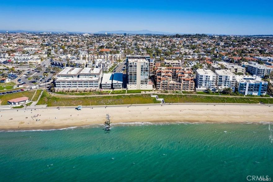 Experience coastal living at its finest in this top-floor penthouse, offering sweeping ocean, park, and city views. This spacious 1-bedroom, 1.5-bath residence has been tastefully updated in a contemporary style, offering comfort and sophistication. The open living and dining area features laminate wood flooring and flows seamlessly to two balconies, perfect for enjoying sunsets, sparkling ocean views stretching along the sandy beaches of South Redondo, all the way to Malibu, and the dramatic backdrop of DTLA and the Mountains. The kitchen is appointed with quartz counters, stainless steel appliances, wine fridge and modern finishes, while the convenience of an in-unit stackable washer and dryer makes daily living effortless. The generous bedroom suite includes direct balcony access, a beautifully updated bath, and an immense walk-in closet that provides exceptional storage. A guest powder room completes the floor plan. Amenities include a clubhouse, swimming pool, hot tub, fitness center, and secure gated entry. Two-car tandem parking plus additional storage offer plenty of room for vehicles and coastal gear. Residents enjoy direct access from the garage to the beach and bike path, and the home is just steps to the weekly Farmers Market, Veterans Park, and minutes to shopping and fine dining in the Riviera Village. This penthouse combines convenience, style, and panoramic views for the ultimate South Bay beach city lifestyle.*Some Pics virtually staged**