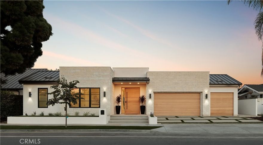 Experience the pinnacle of Newport Beach living in this brand-new, single-story masterpiece spanning 4,677 square feet of refined design and modern luxury. Set on one of Dover Shores’ most desirable streets, this architectural gem blends sophisticated style with effortless indoor-outdoor living. Step inside to soaring ceilings and a dramatic 33-foot motorized sliding glass wall that opens seamlessly to your private backyard retreat complete with a sparkling pool, BBQ island, firepit, and elevated deck for entertaining under the sun or stars. The heart of the home is the chef-inspired kitchen, featuring Thermador appliances, Le Blanc quartzite countertops, and a walk-in pantry, all framed by custom cabinetry and natural stone finishes found throughout the residence. The 1,000 sqft primary suite is a sanctuary, boasting a coffee bar, his-and-hers layout, makeup vanity, freestanding tub, and an oversized shower wrapped in breathtaking Michelangelo Dolomite quartzite slabs. Three additional ensuite bedrooms, a glass-enclosed office, and a den provide versatility for family and guests alike. Upstairs, the expansive rooftop deck delivers panoramic, “forever” Back Bay views, complete with a firepit, BBQ, and bathroom, creating the ultimate space for sunset gatherings. Additional highlights include a 3-car garage and a fully integrated Savant home automation system, ensuring every modern convenience is at your fingertips. This is modern coastal living at its finest. 1918 Santiago is a home where every detail is intentional, every finish is natural, and every view is extraordinary.