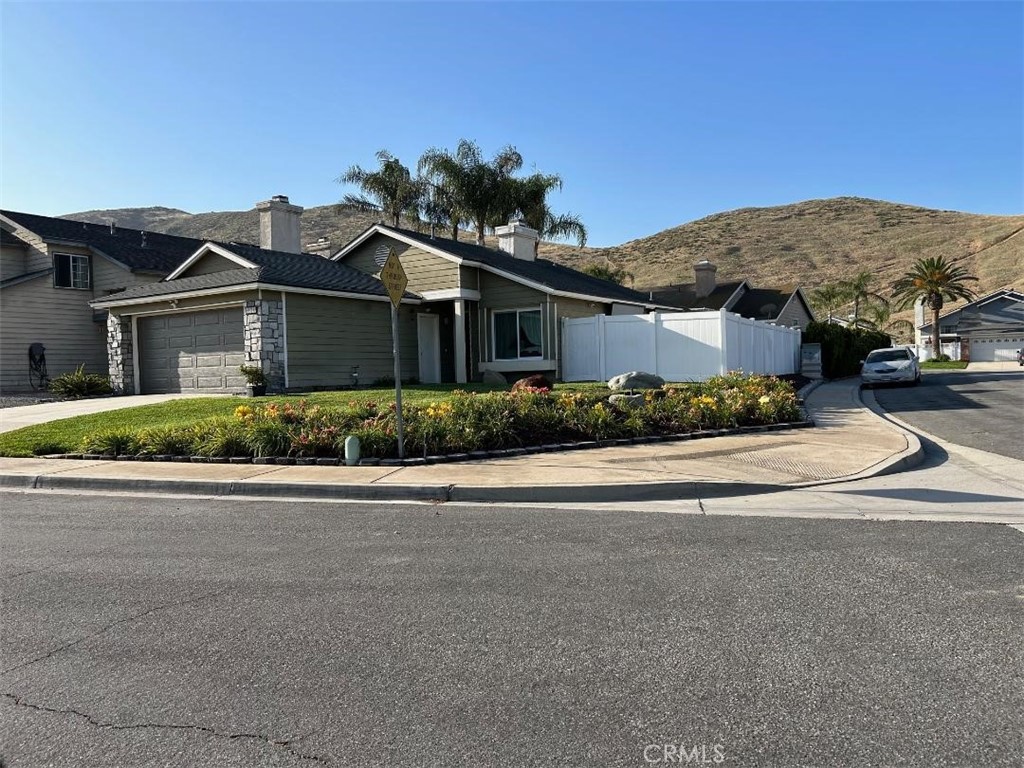 Presenting a beautiful Southridge Village Home nestled in a well-established neighborhood. This 2bd, 2ba home has been magnificently remodeled and is equipped with a dishwasher, range, and refrigerator. The two car garage has a new opener and includes upper and lower built-in cabinets. In addition to a new front door, you'll enjoy new engineered wood floors throughout. This home has new dual pane windows including the sliding patio doors. The kitchen and the bathrooms have new flooring too. In addition to central air, there are new ceiling fans with remotes in this home as well. The kitchen and fireplace boast matching Arabesque Carrera marble. This desirable corner lot features a fully fenced/walled backyard with a relaxing inground spa. The home is within walking distance of Oak Park as well as the elementary, middle, and high schools. Southridge Village is a quiet, family-oriented community with its own fire and police departments. There are two nearby shopping centers with a variety of restaurants, a community center with a park, tennis/ basketball courts and a public swimming pool. This is a turnkey home with lots to offer!