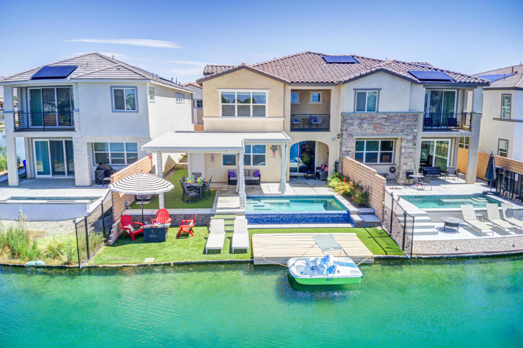 Welcome to your desert getaway in the highly sought-after community of Terra Lago in Indio, California. This fully furnished 4-bedroom, 4-bathroom home is perfectly positioned on the lake, offering spectacular west-facing views that light up with unforgettable desert sunsets. Designed for both relaxation and fun, this home features a private pool, paddle boat for lake adventures, and an entertainment-filled game area with a foosball table and air hockey table. Whether you're lounging by the water, exploring the lake, or enjoying indoor activities, there's something for everyone. Inside, the home offers a spacious layout with modern furnishings, a water softening system for added comfort, and all the essentials for an easy, stress-free stay. Located just minutes from world-class golf, festivals, dining, and shopping, this Terra Lago retreat is the perfect rental for making lasting desert memories.